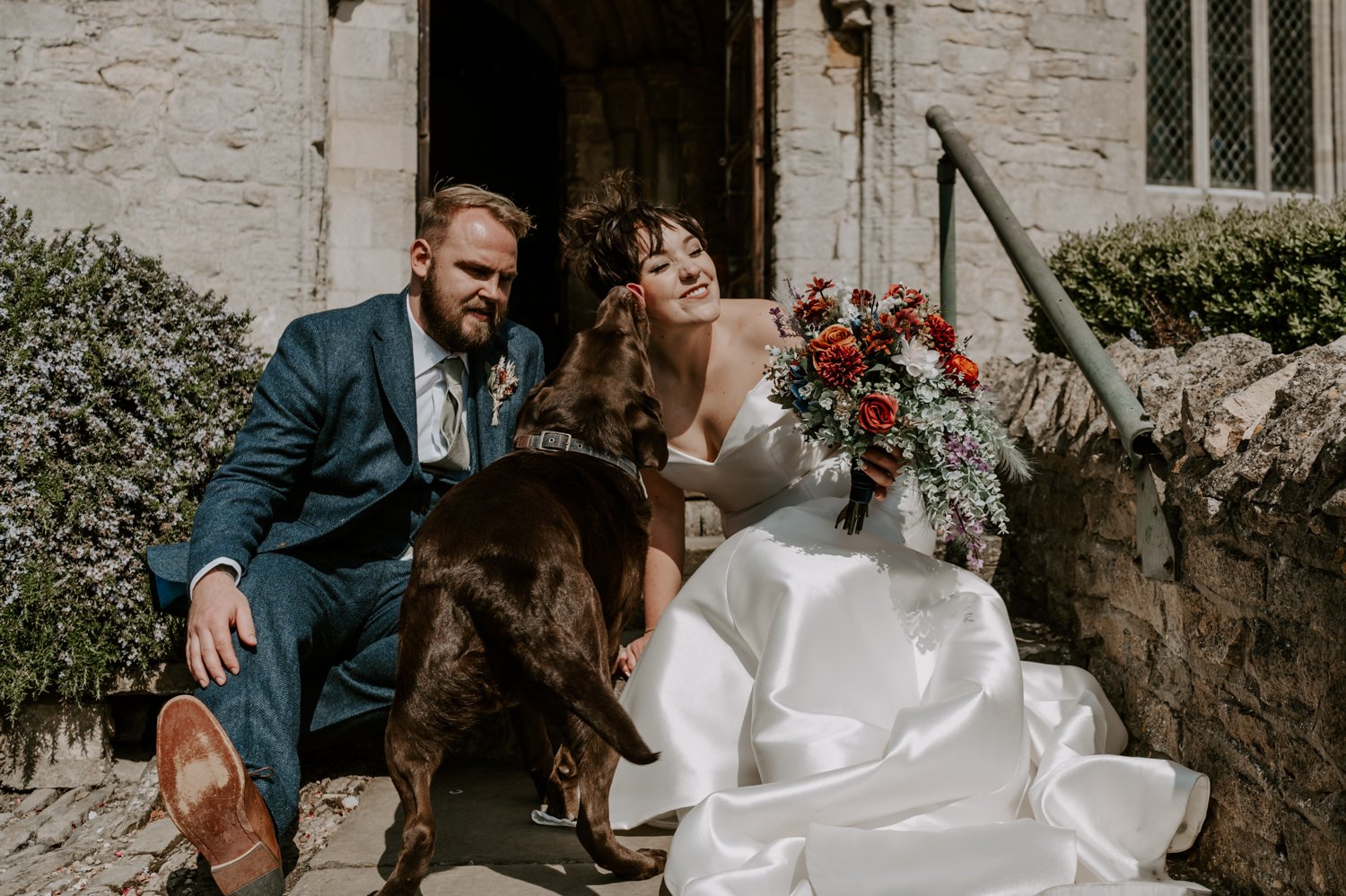 dog licking brides face mardi gras village hall wedding Peterborough