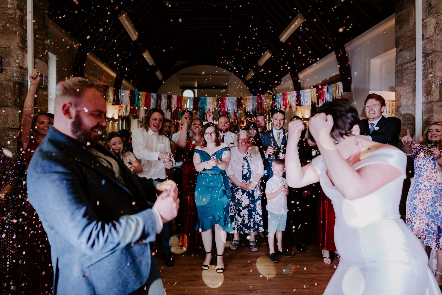 festival wedding dance floor bride groom dancing crowd watching mardi gras village hall wedding Peterborough