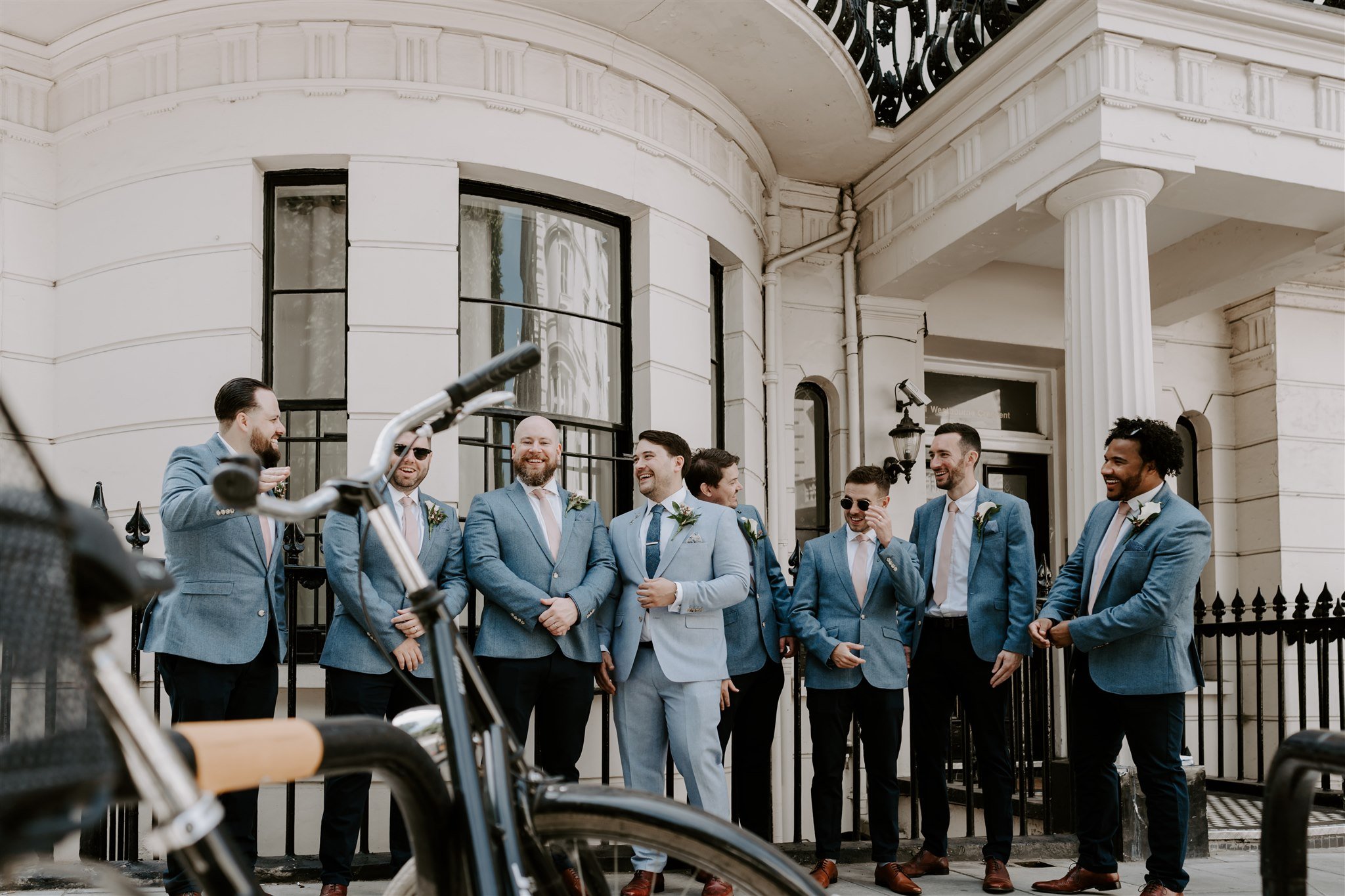 groom groomsmen waiting outside town house London pizza party wedding