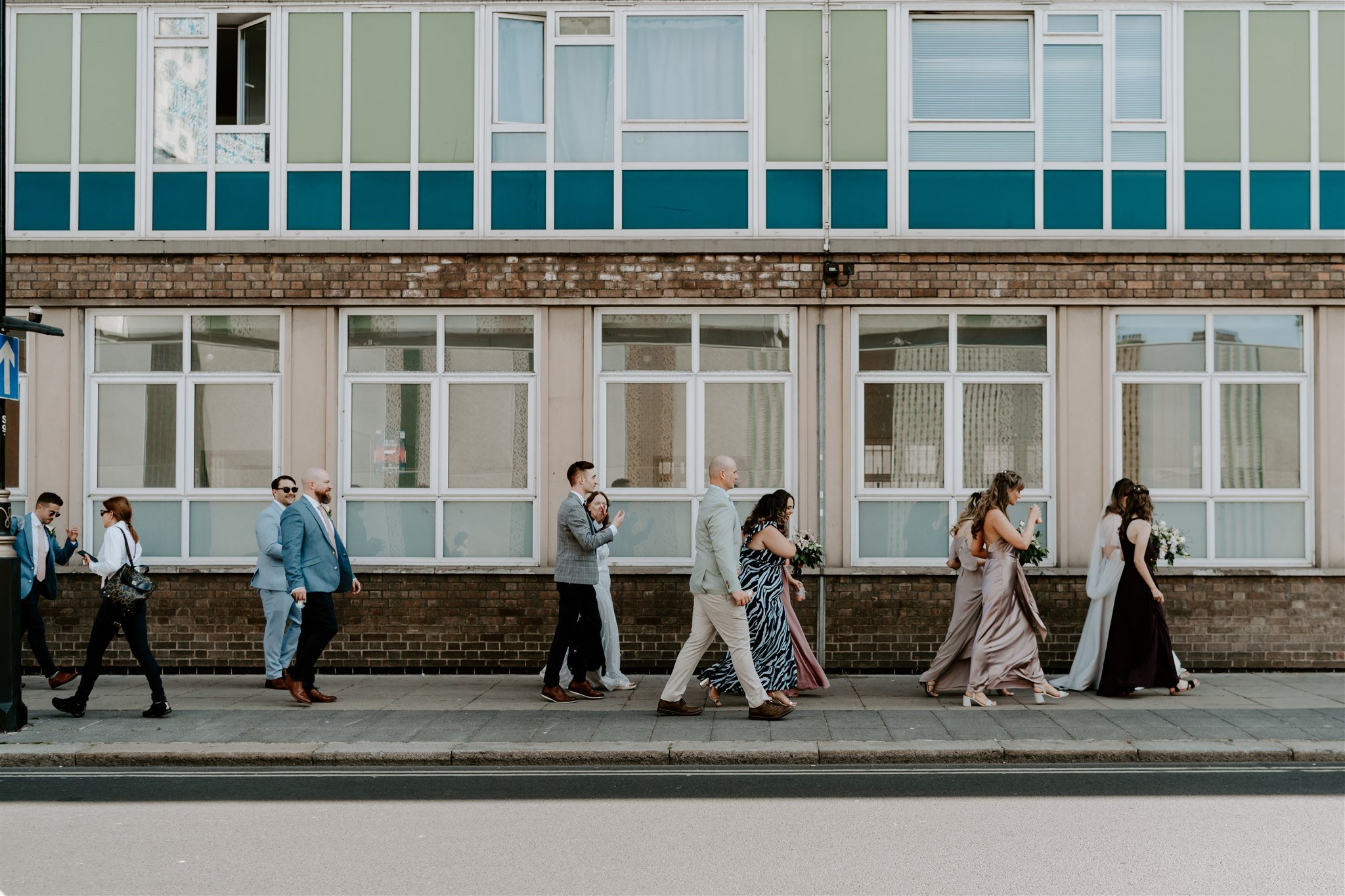 wedding party walking Paddington London wedding venue Heist Bank