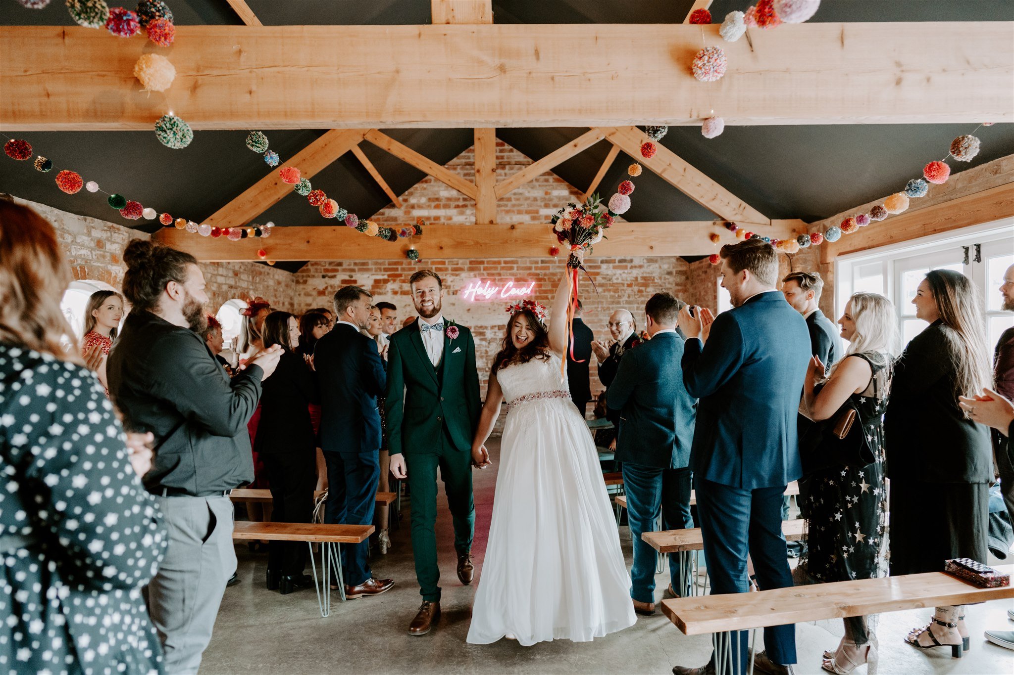bride groom cheer after wedding ceremony old cow shed leicestershire