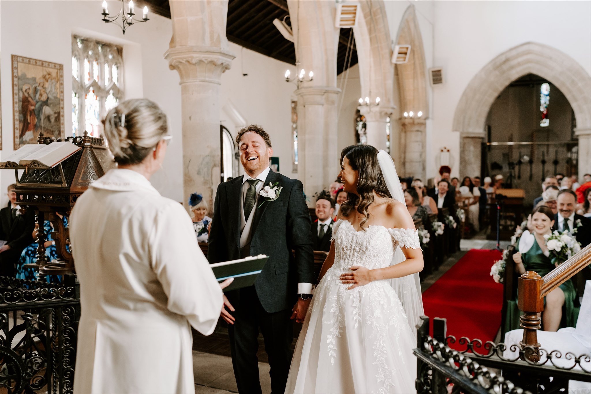 hambleton church wedding couple laughing exchanging vows