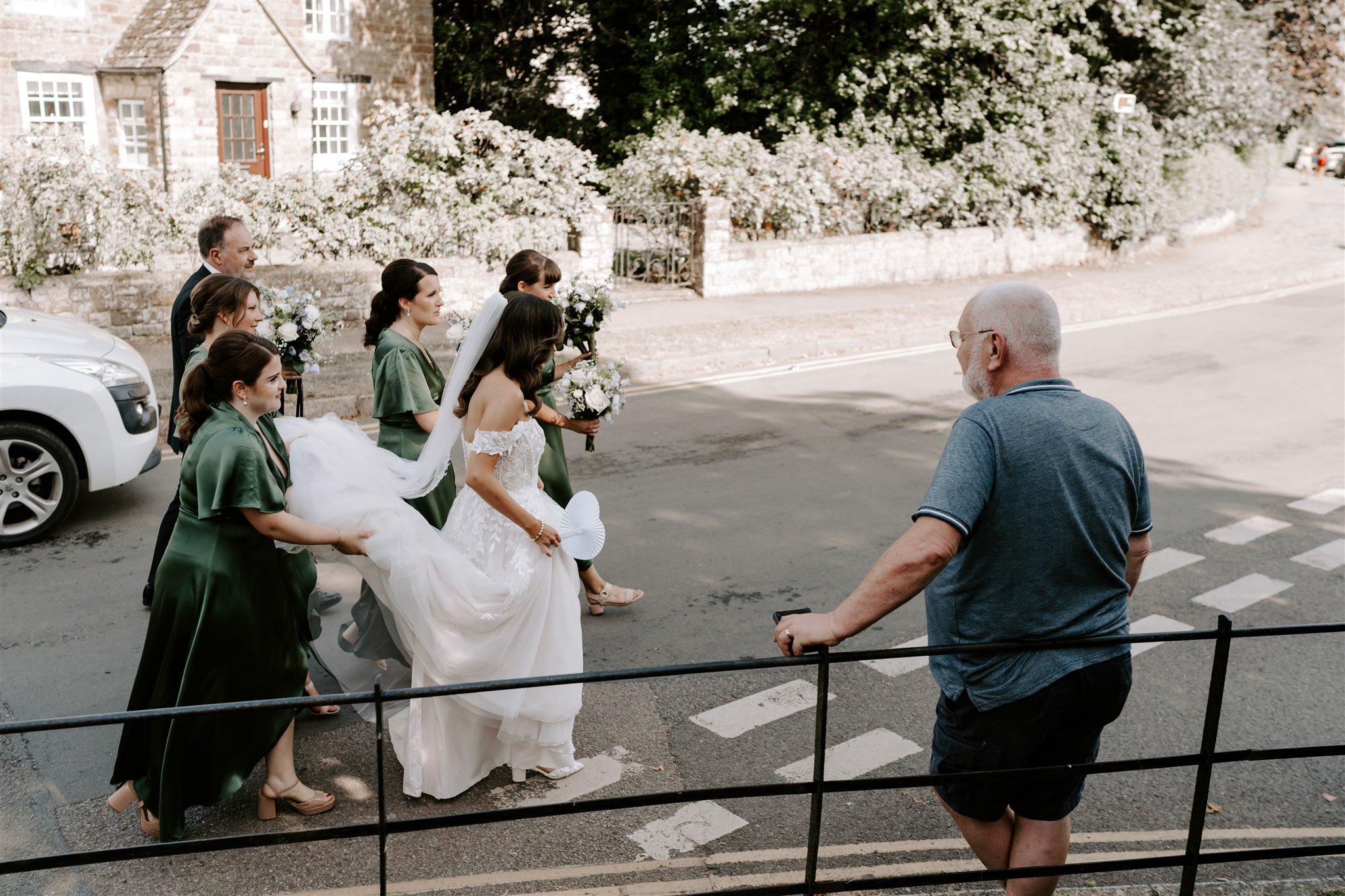 bride and bridesmaids walking to hambleton church finchs arms wedding 