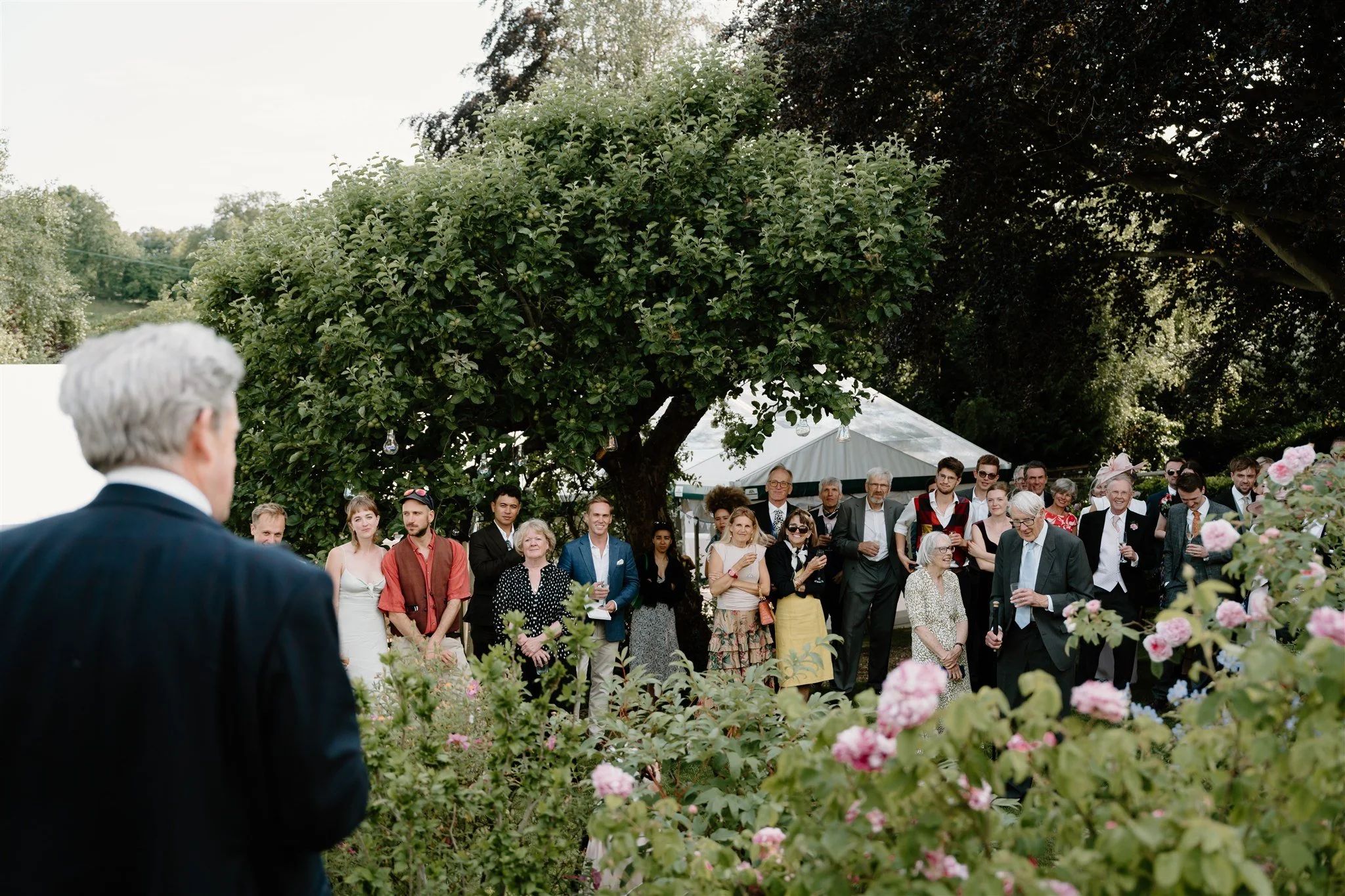 guests enjoying wedding speeches garden marquee wedding Rutland