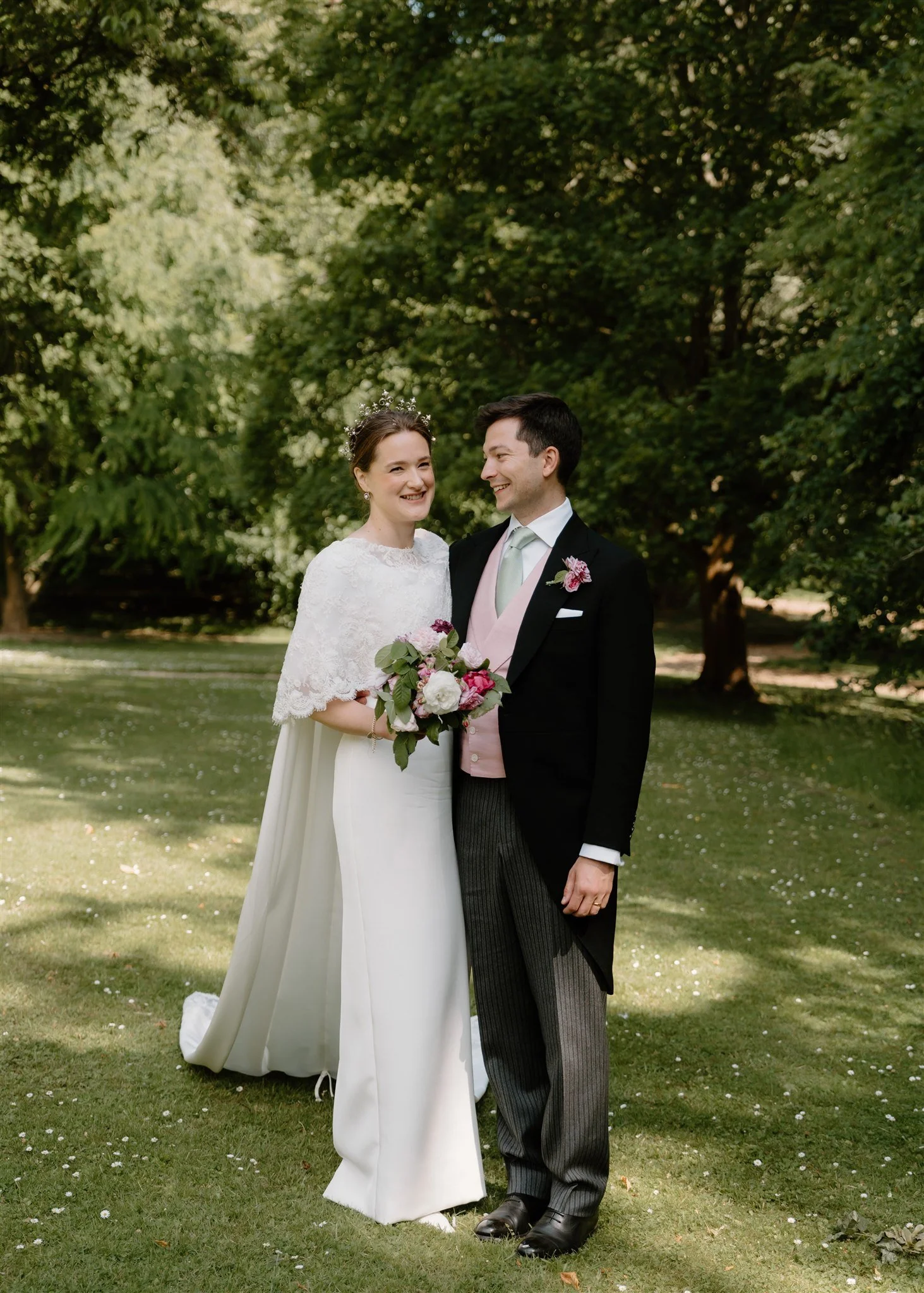 bride and groom laughing after wedding in Exton Chapel, Rutland