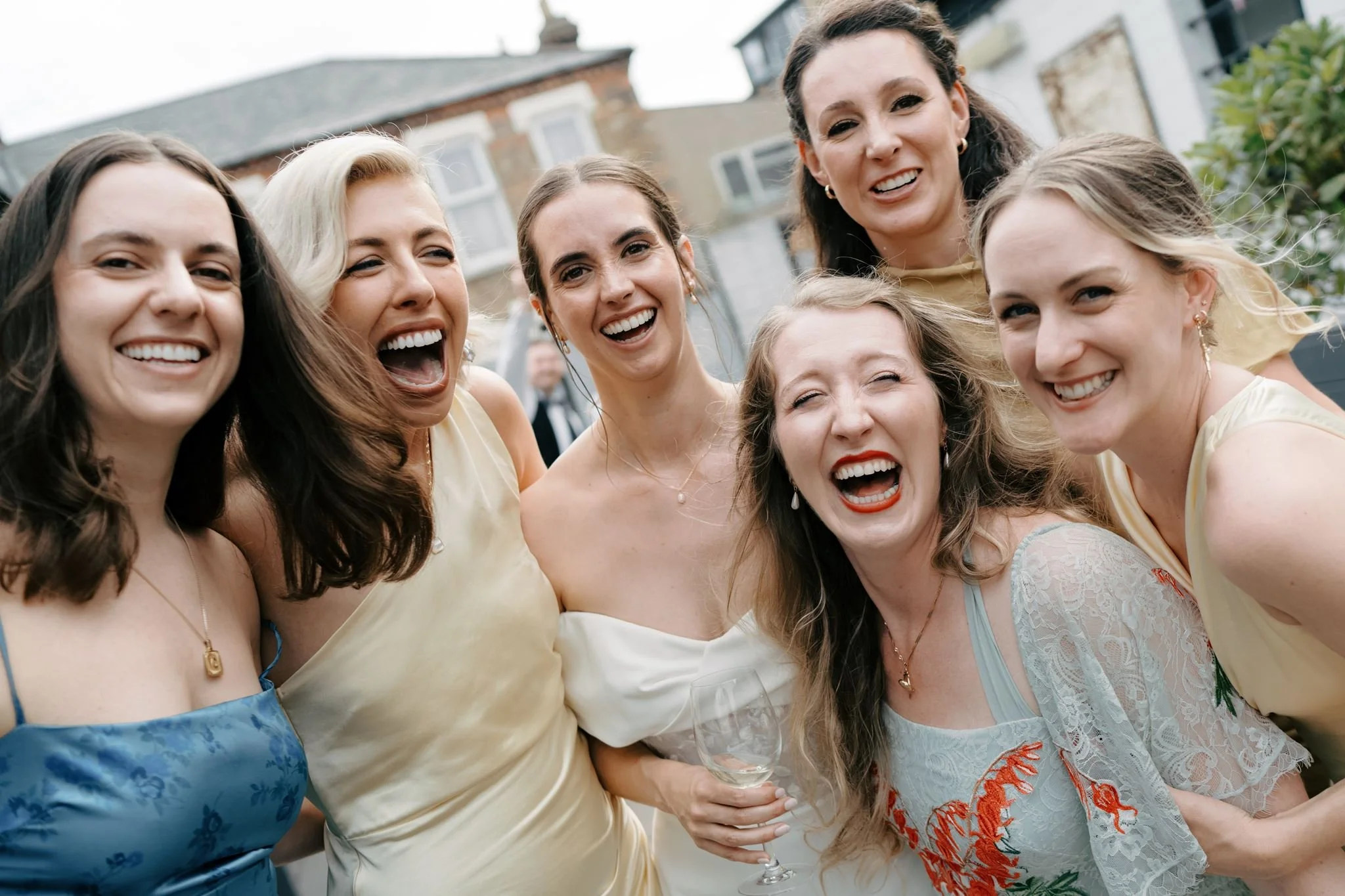 bride with friends laughing into camera  | Gina Fernandes Photography