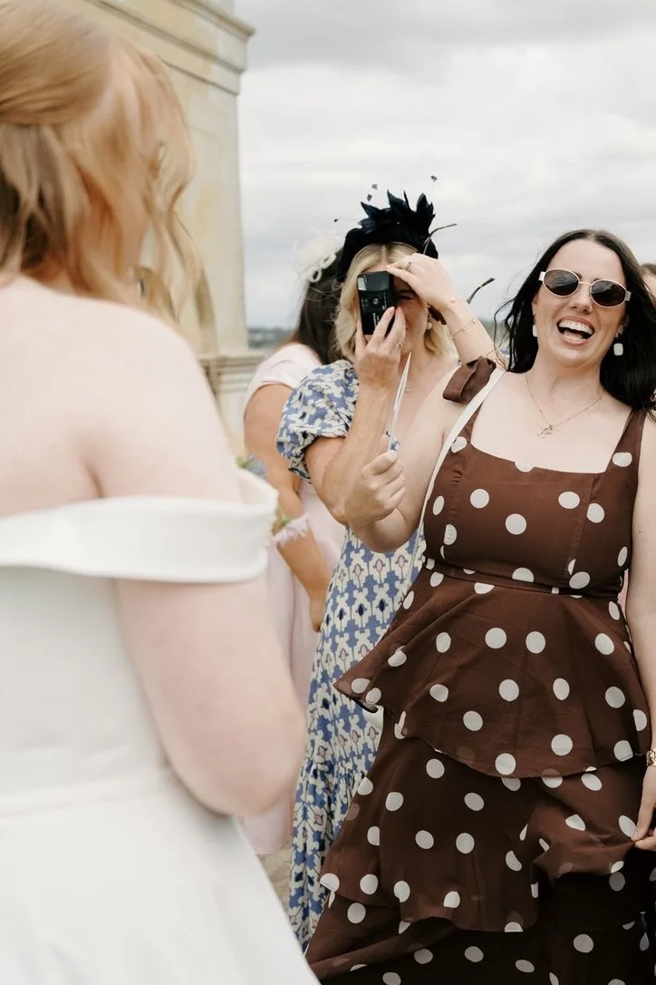 Disposable camera print beside a professional wedding photograph | Gina Fernandes Photography