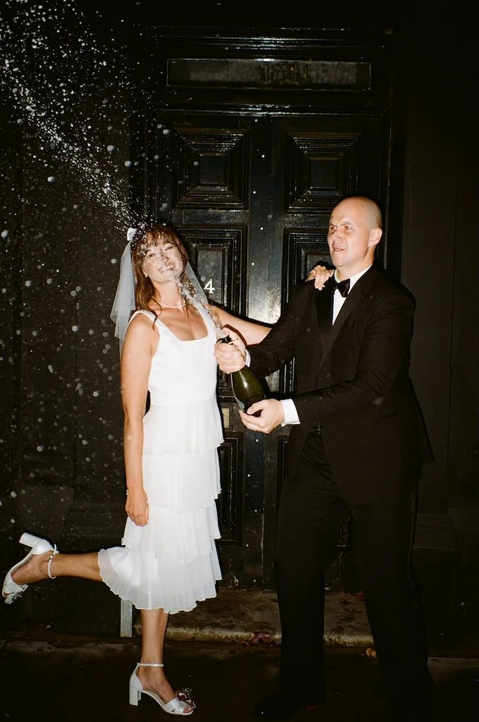 champagne spray outside The Hackney Wedding London