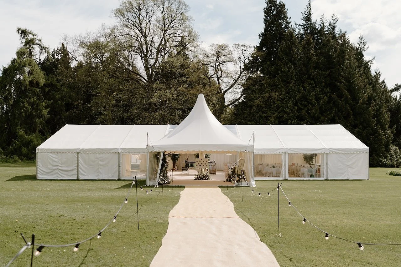 Marquee wedding entrance set up on the lawns at Exton Park, Rutland.