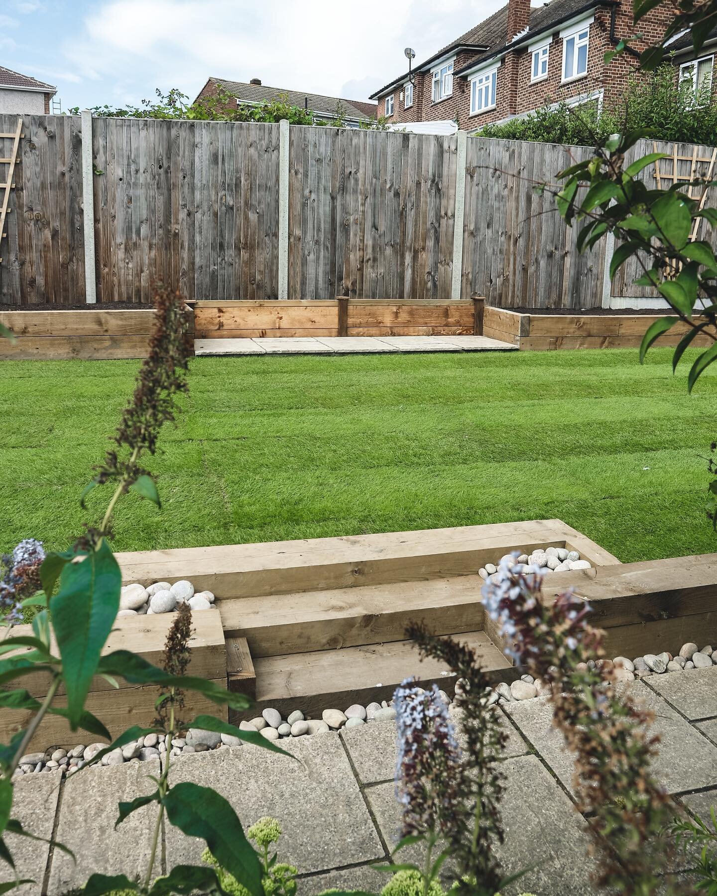 We completely redesigned this garden over Summer. We installed a new fence, lawn, 2 large sleeper beds with a wall running round the whole garden, a new shed was installed over an area of decorative stone as well as a small paved area that will have 