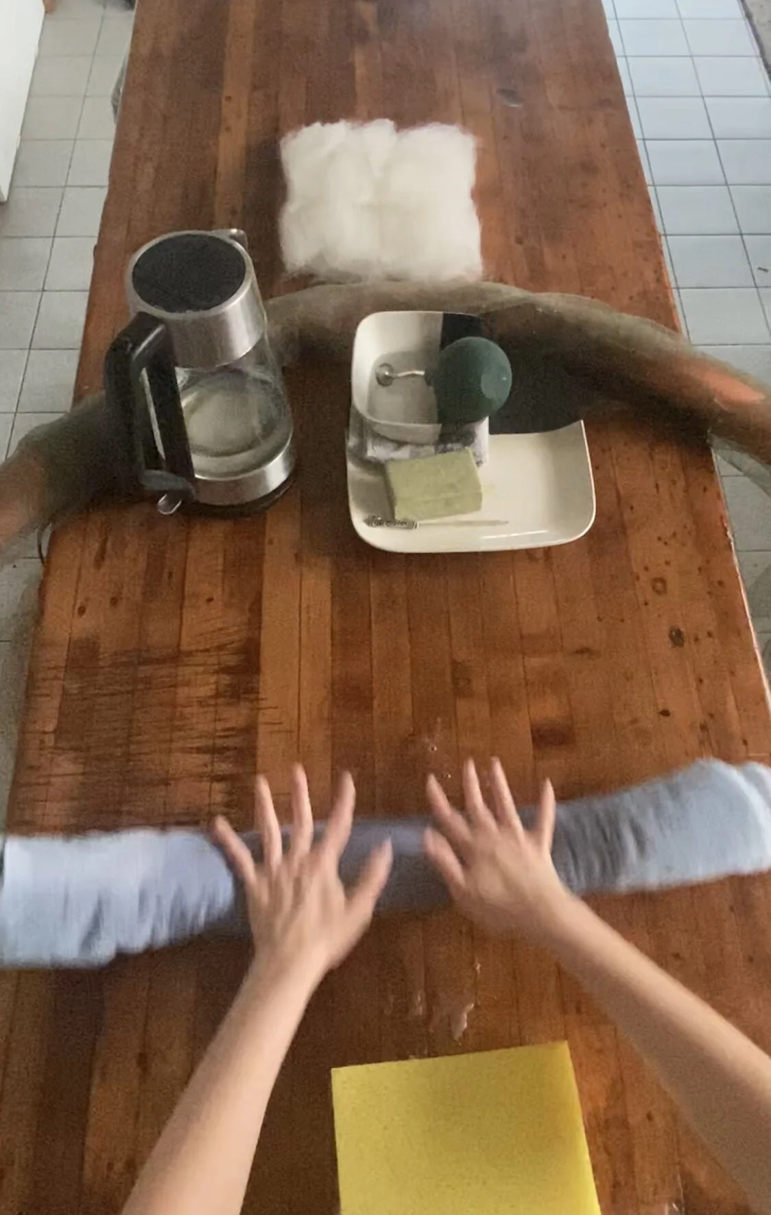 Hardening and Fulling- Roll the towel back and forth.  To ensure even felting, repeat this step while rotating the bat 1/4 turn each time inside the towel on both front and back sides.