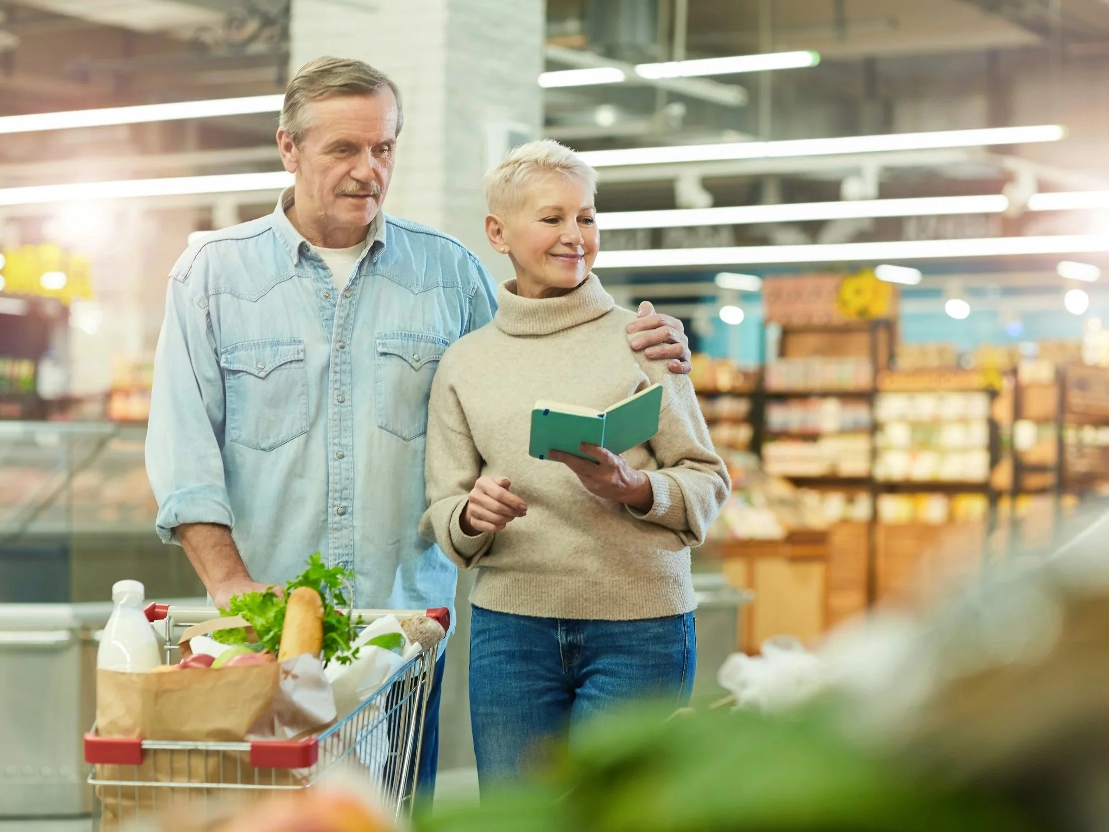 a couple reads their grocery list