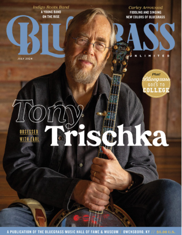 Cover of Bluegrass magazine July 2024 featuring Tony Trischka holding a banjo, wearing glasses and a dark button-up shirt, with a wooden background.