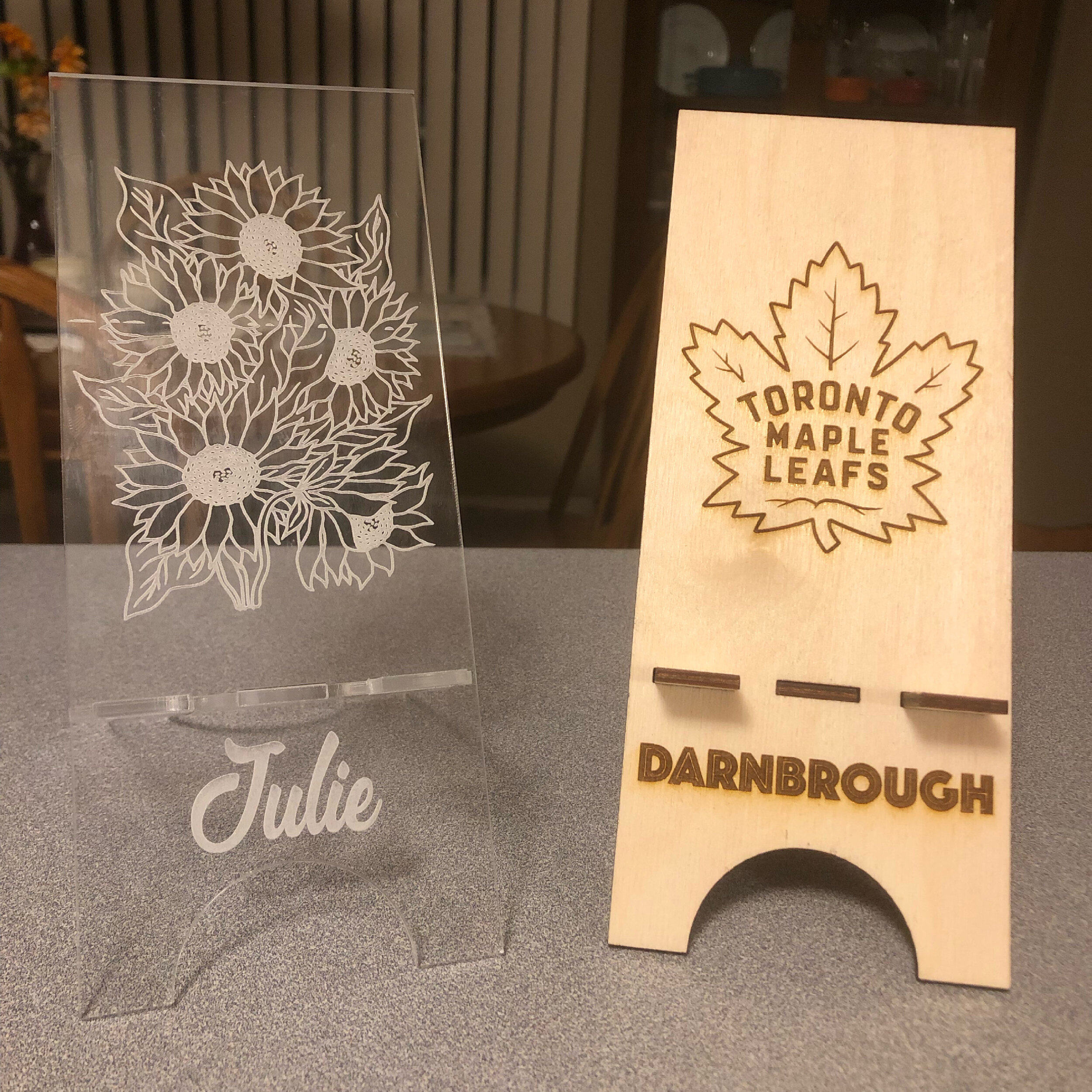 Acrylic or Wood Cell Phone Stand.
These can be personalized with pictures, names, and logos.