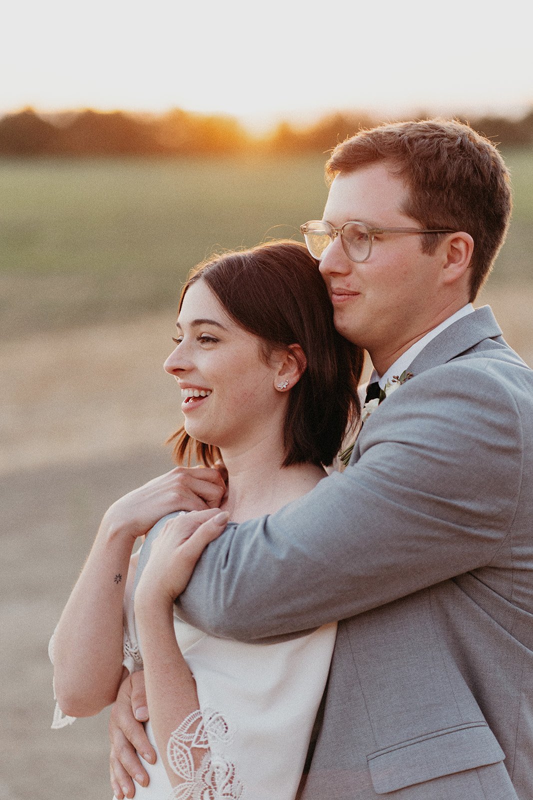 bride and groom portraits during golden hour with sunset
