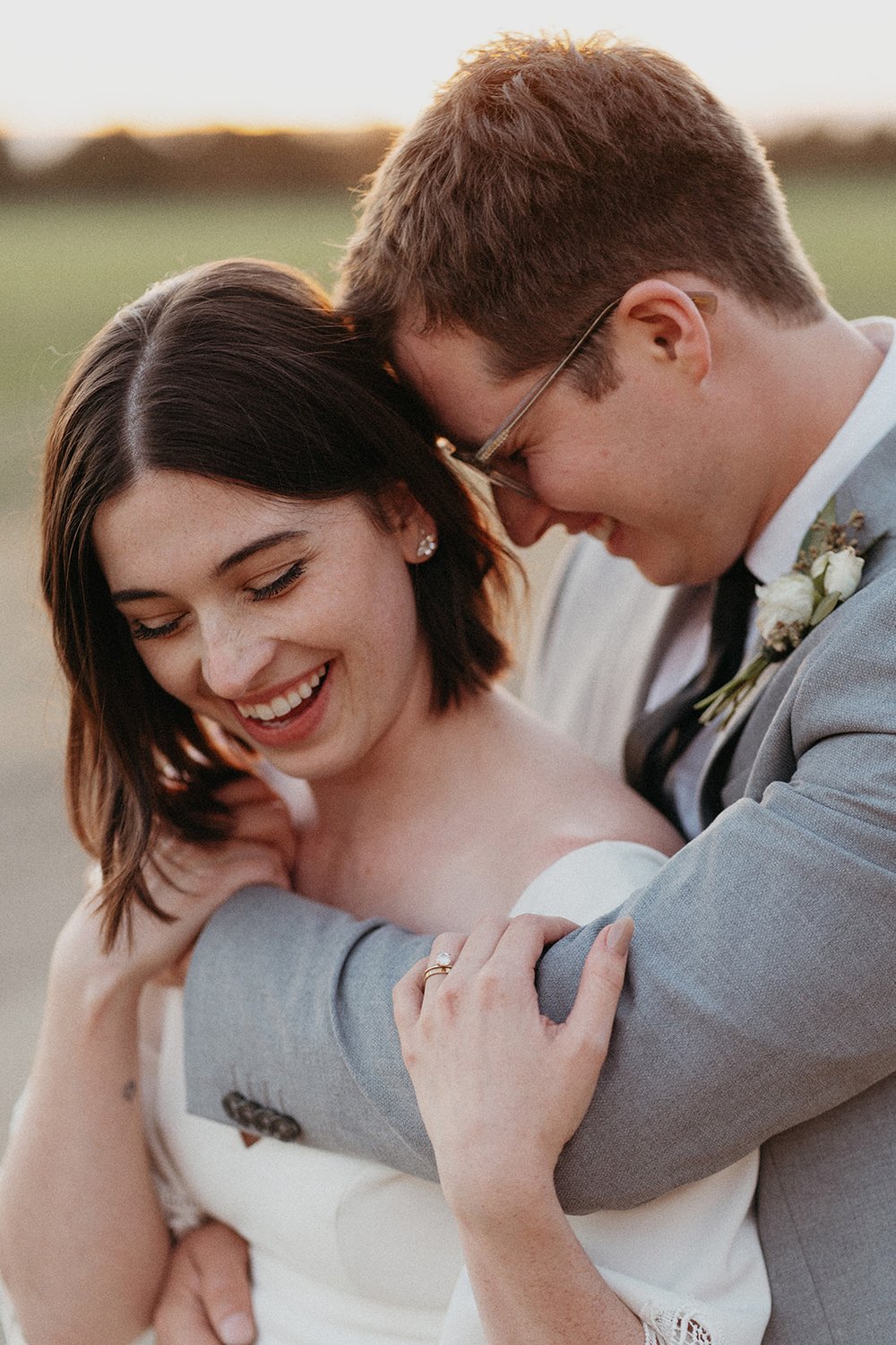 bride and groom portraits during golden hour with sunset