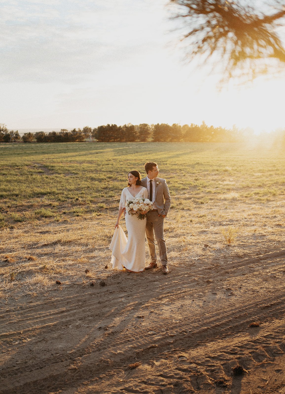 bride and groom portraits during golden hour with sunset