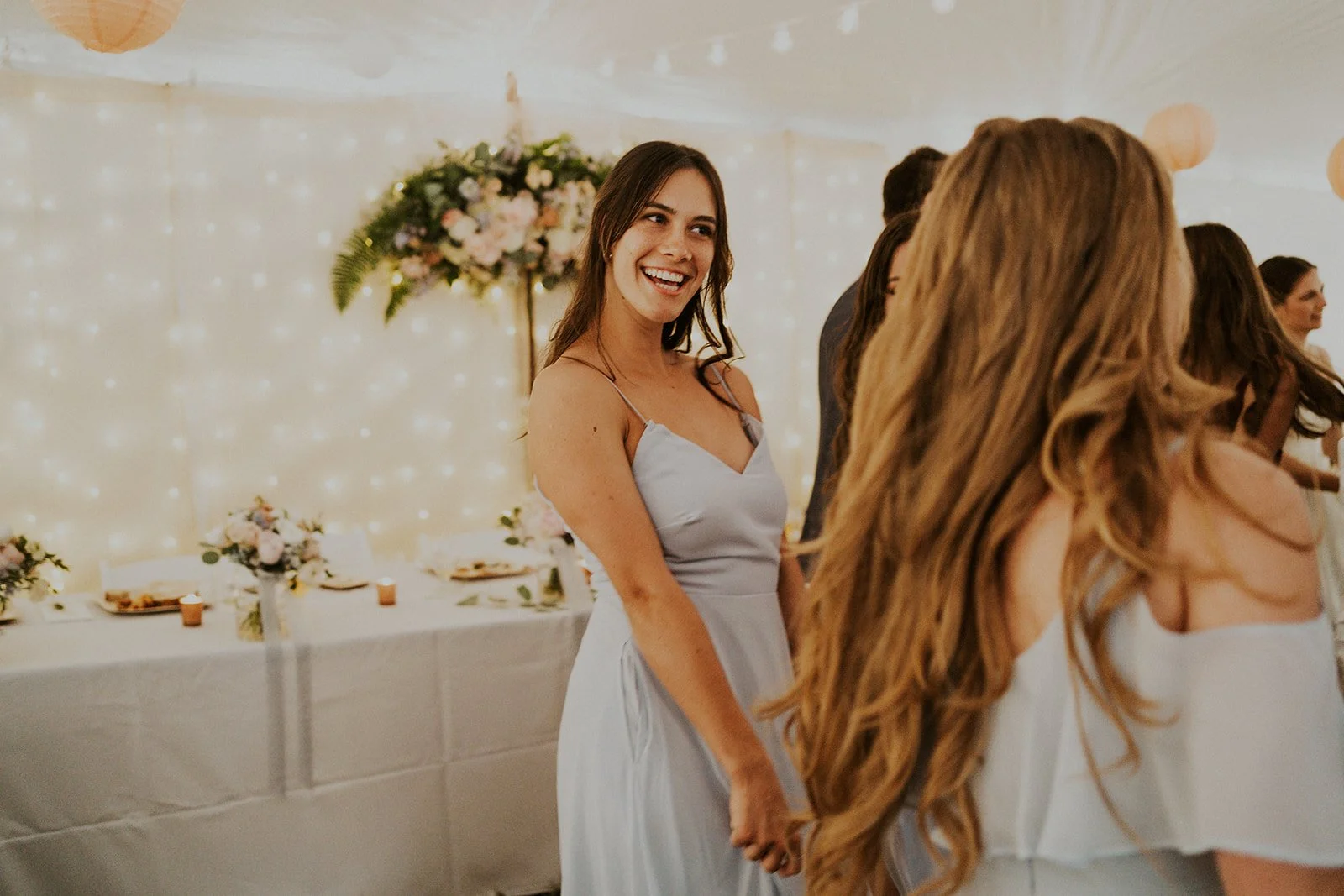 bridesmaids dancing at intimate backyard reception