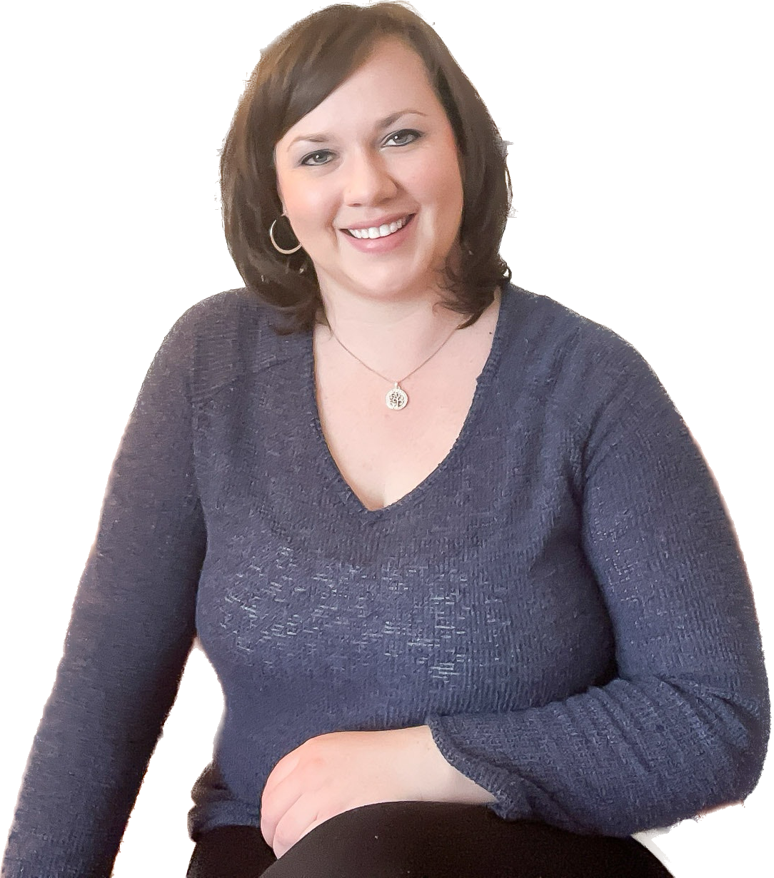 Emily Perraut LLP,  certified Brainspotting consultant offering consultation to therapists in Michigan, seated and smiling portrait