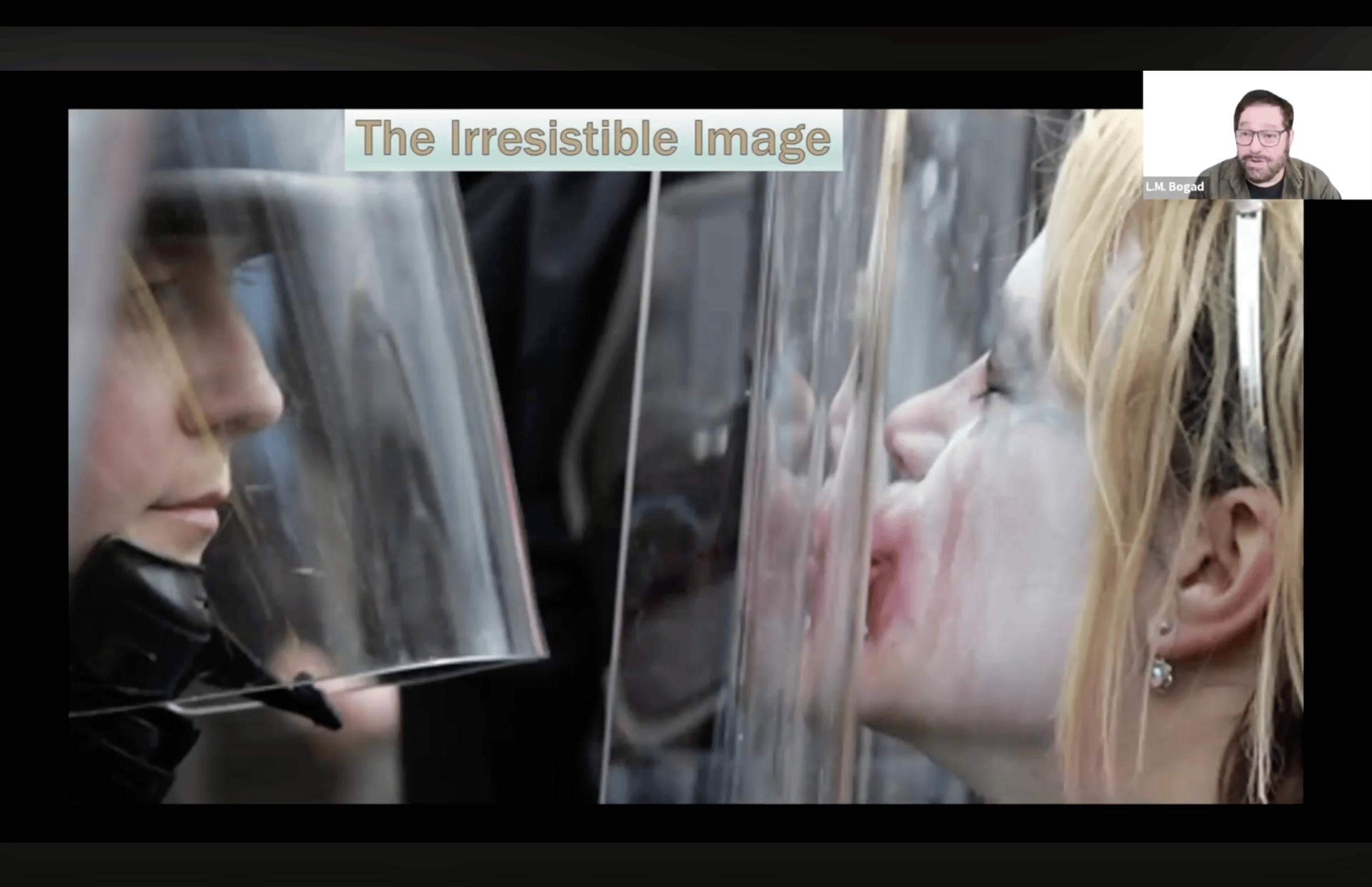 Video still from L.M. Bogad’s Royal Conservatoire of Scotland talk, showing a presentation slide titled “The Irresistible Image” with Bogad visible in the upper-right corner.