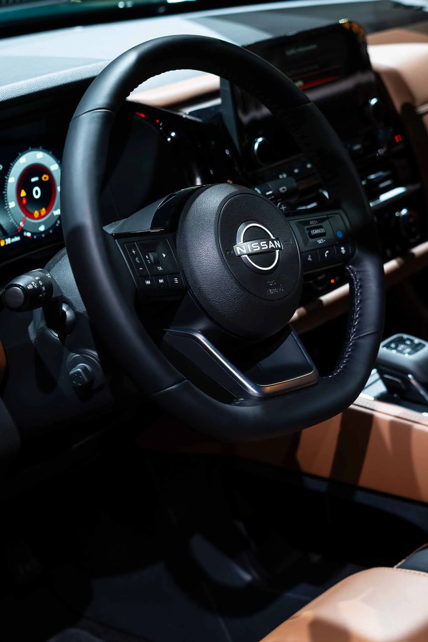 Close up of steering wheel of a Nissan car