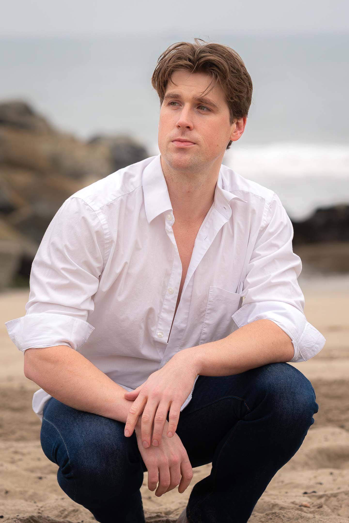Los Angeles beach model sitting on the sand at Santa Monica