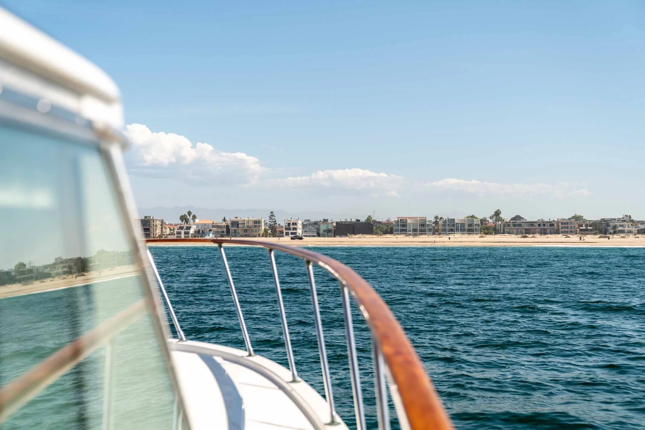 Close up of yacht charter moving towards Marina del Rey shore