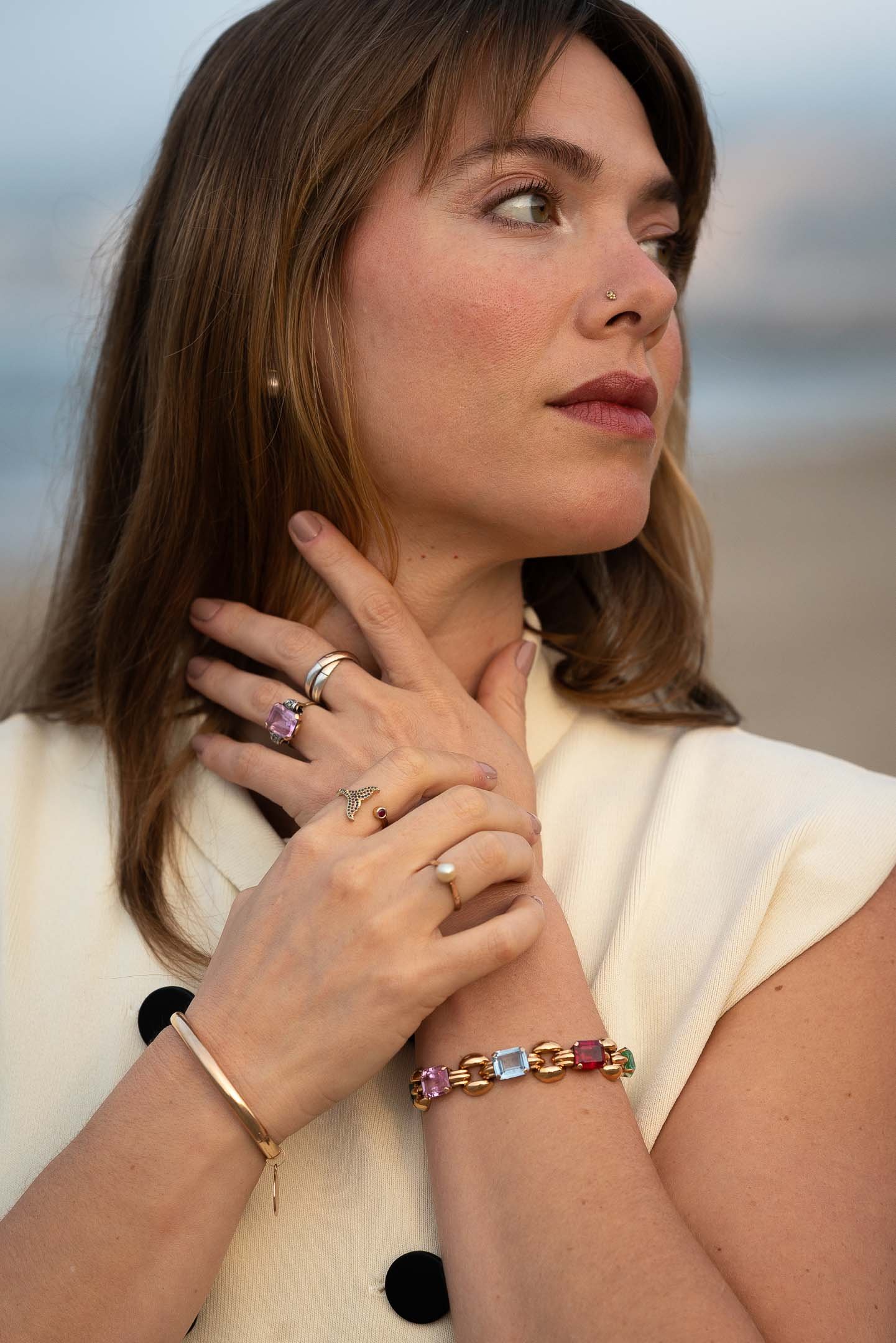 Fashion model wearing beach jewelry at sunrise