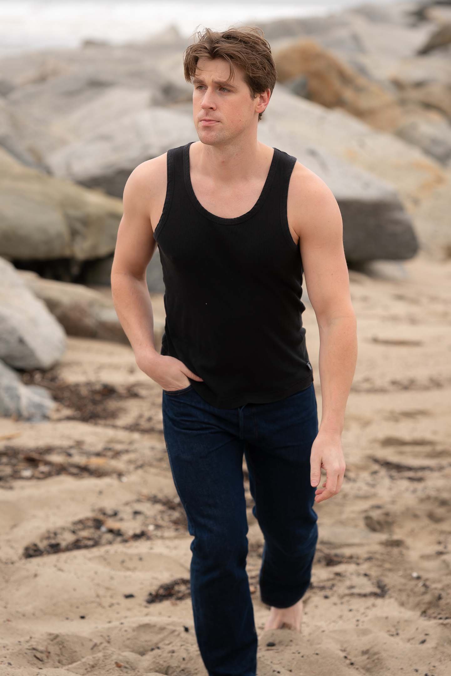 Los Angeles fashion male model walking on the beach