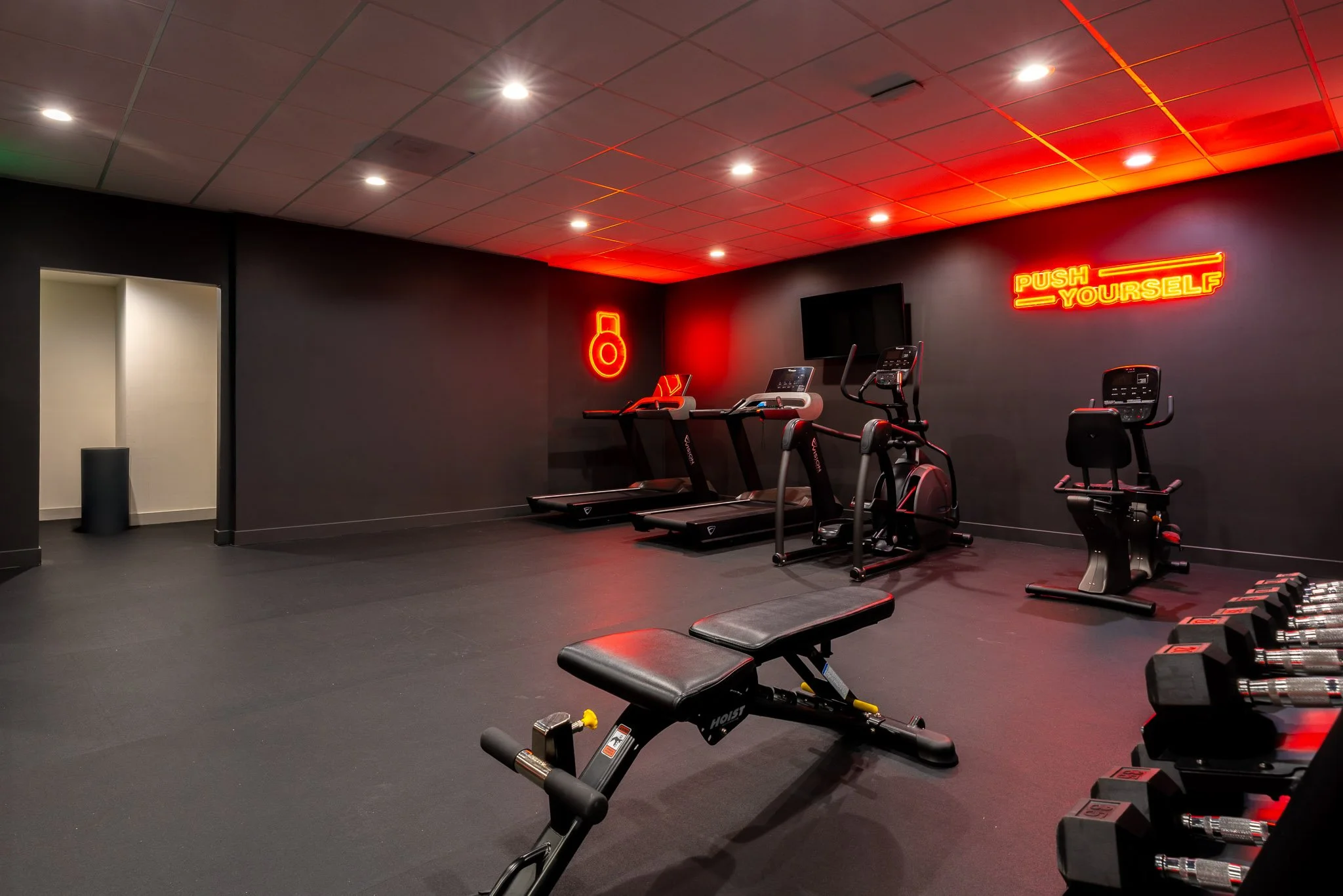Beautiful fitness gym with red signage in Kins Hotel in Los Angeles