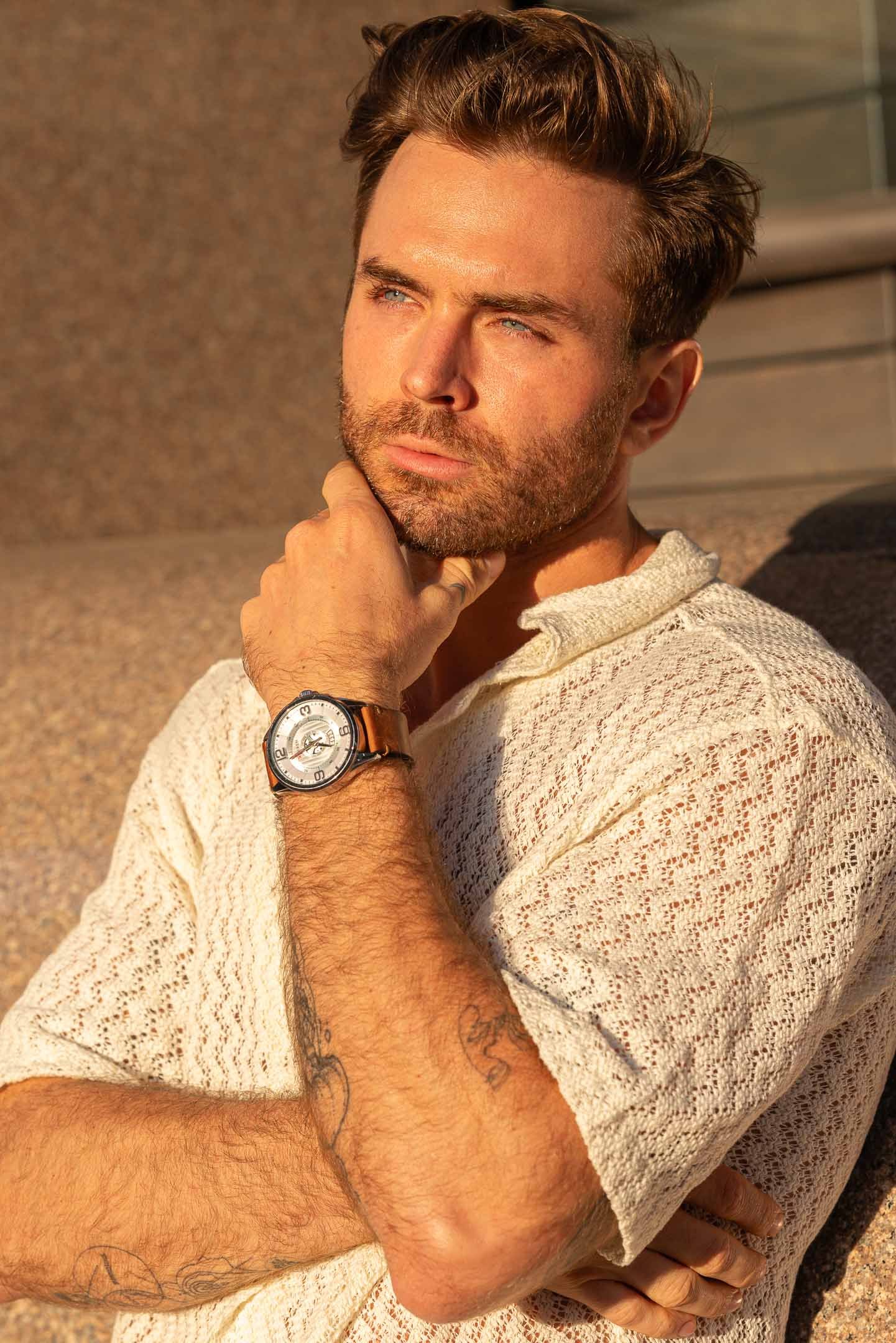 Model posing with watch at sunset in Downtown LA