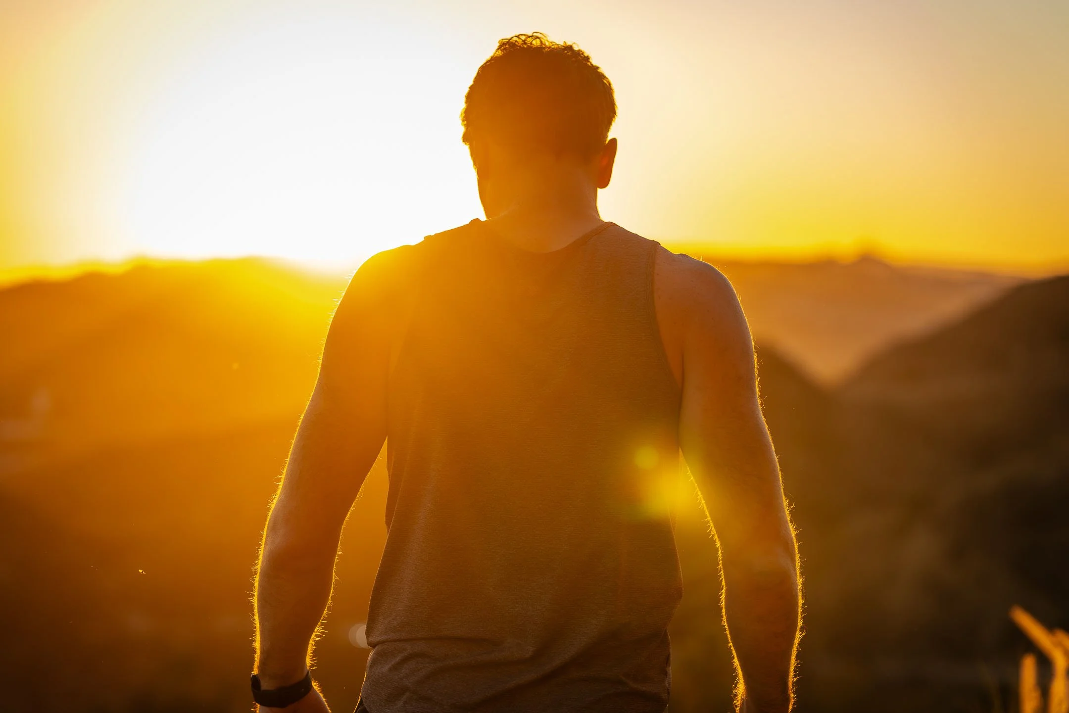 Los Angeles fitness model looking out at the sunset in Mount Hollywood