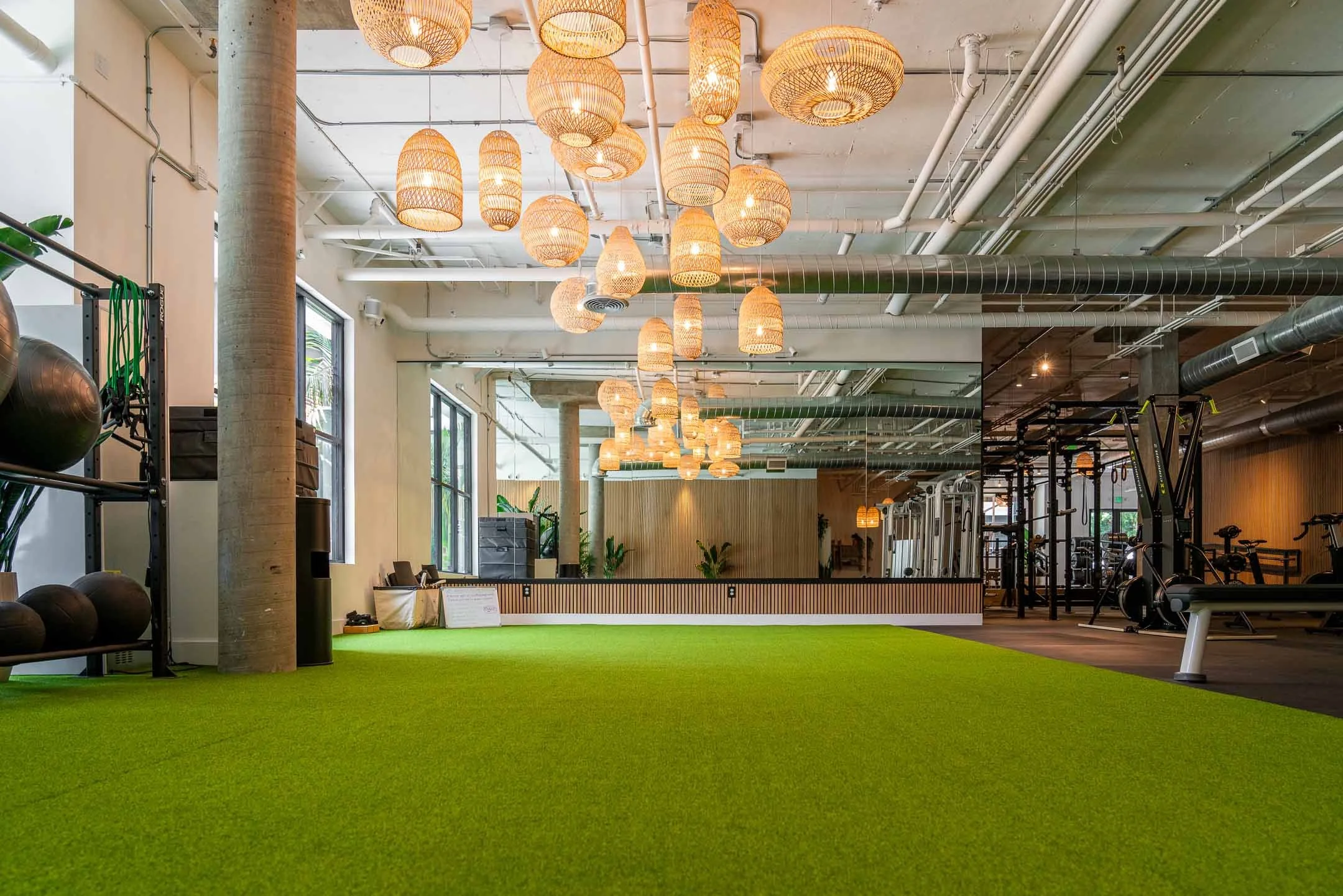 Green turf with beautiful gold ceilings in a Santa Monica gym