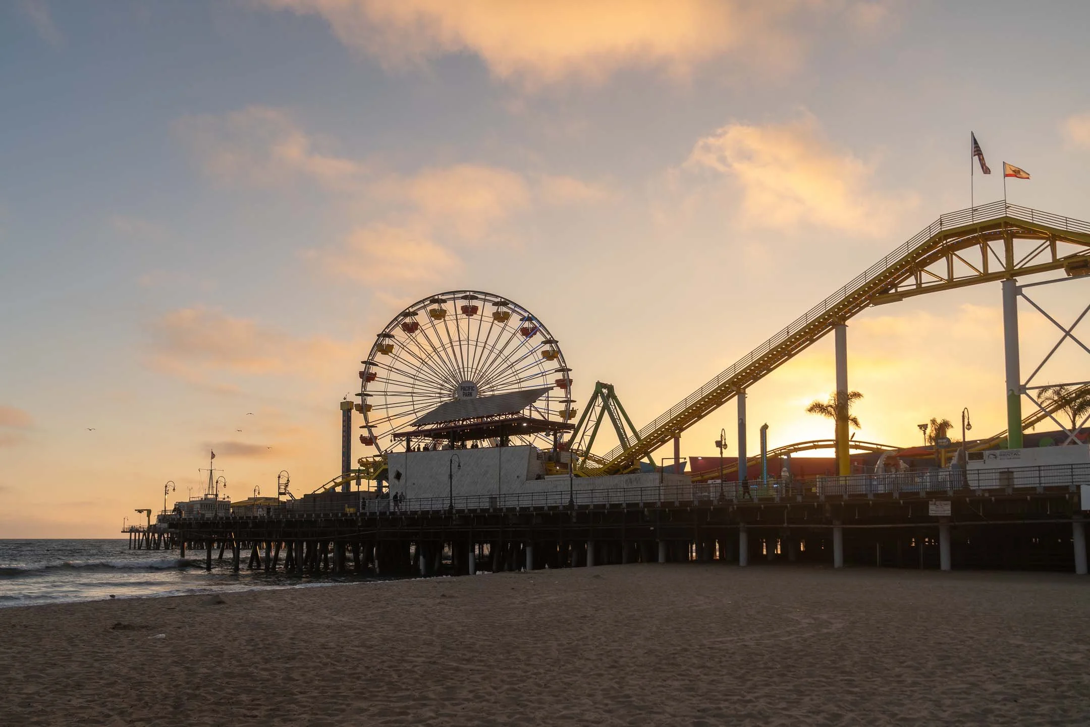 Beautiful sunset with clouds over the Pacific Park ferris wheel