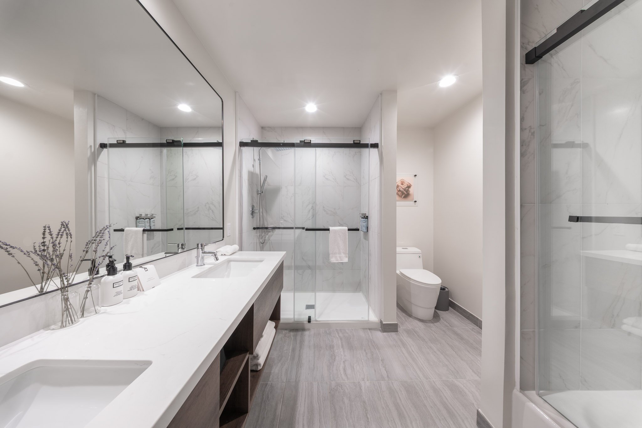 Wide view of bathroom in a deluxe hotel suite for the Kins Hotel in Los Angeles