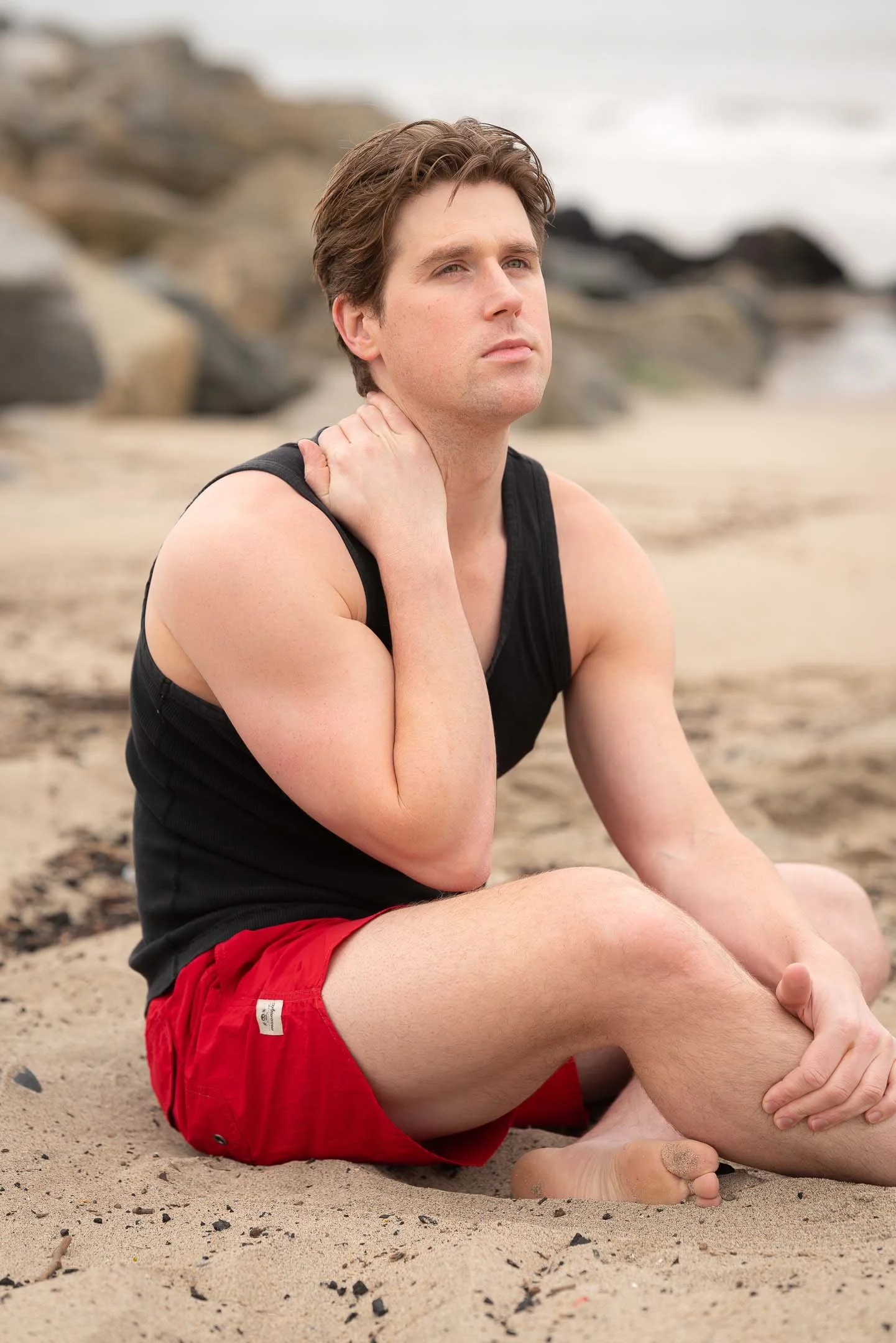 Los Angeles summer fashion model sitting on the beach