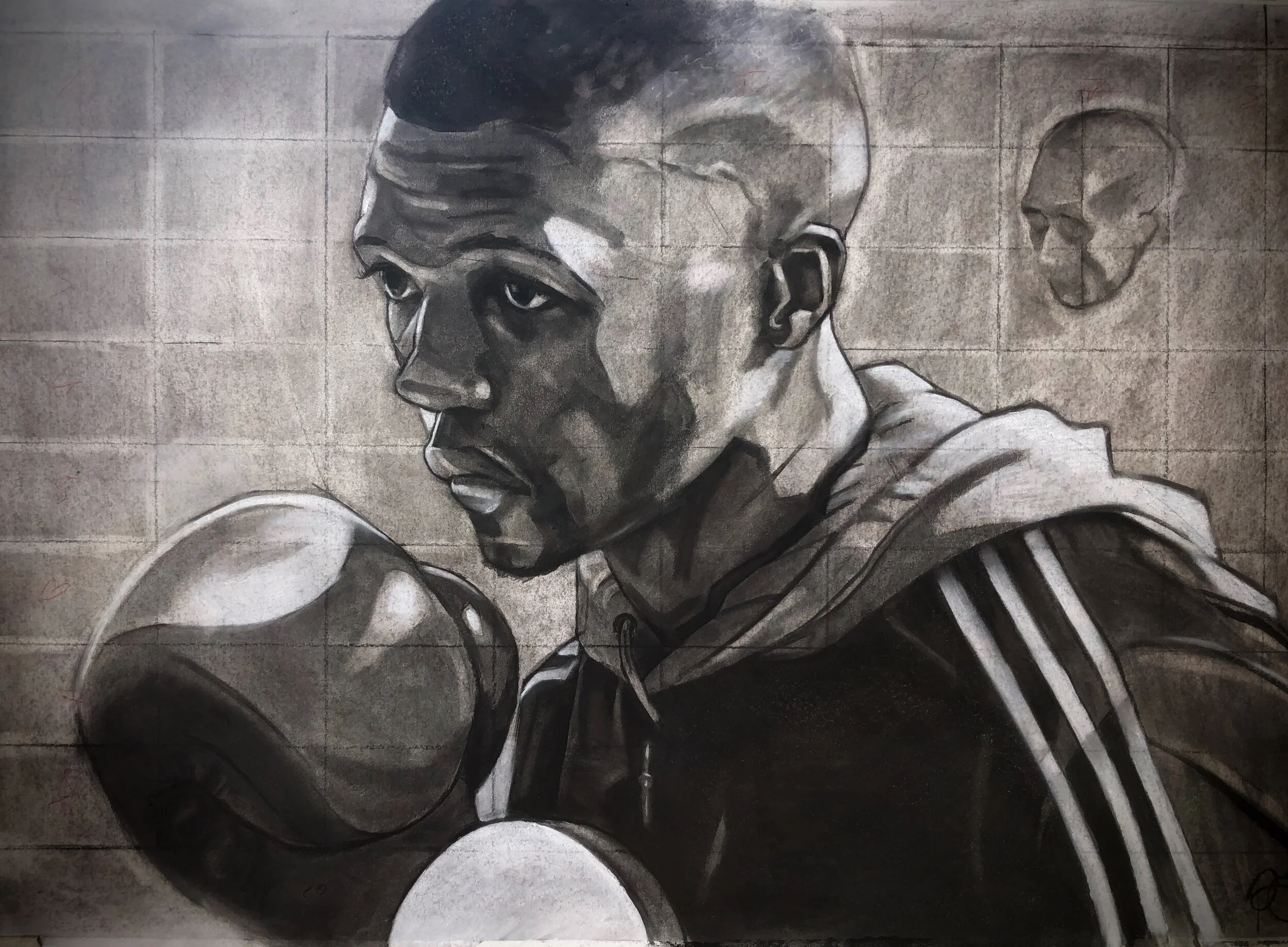 Black and white charcoal drawing of a male boxer with gloves with sketches of a human skull in the background.