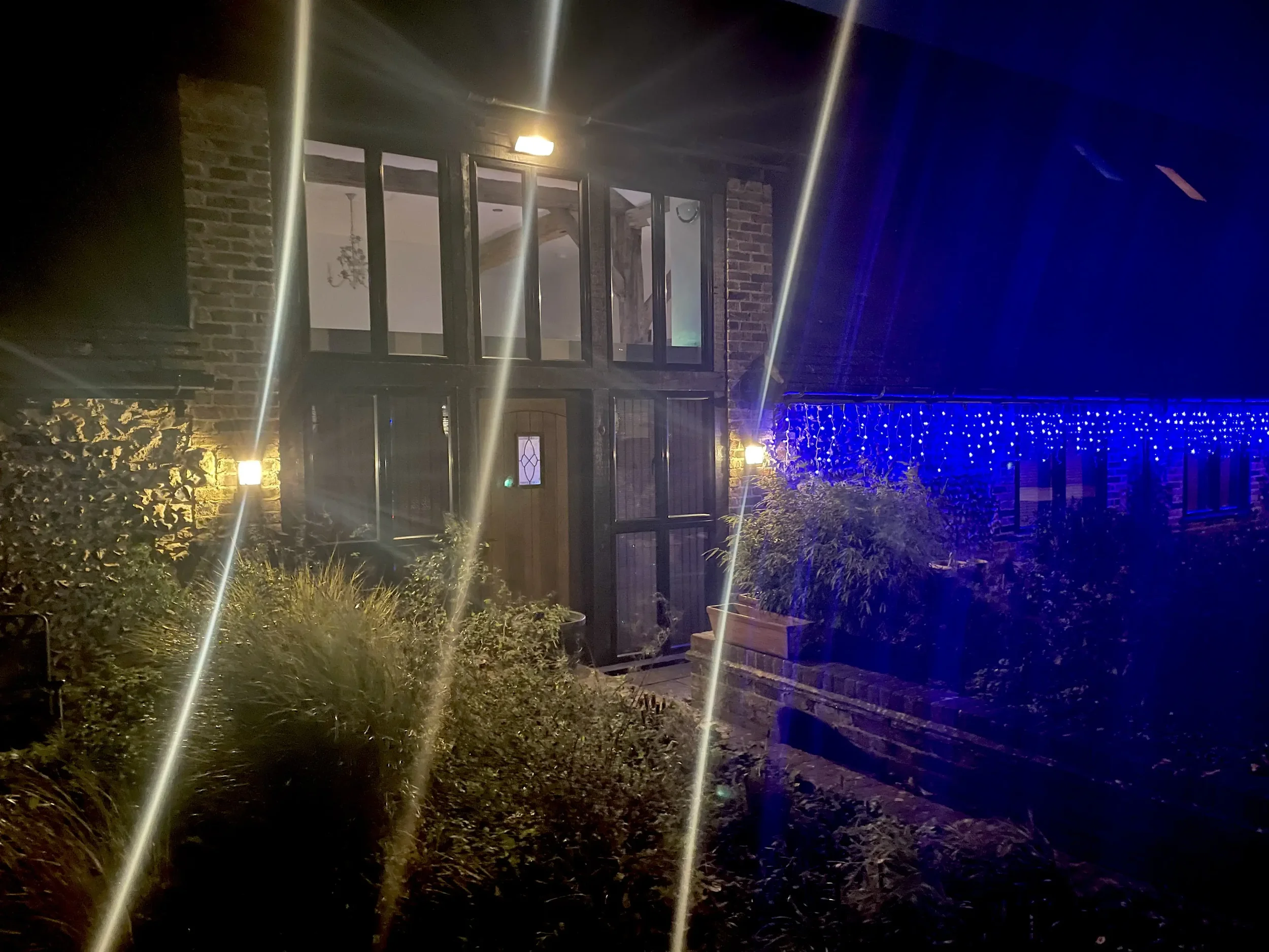 Kingston barn with the lights on outside