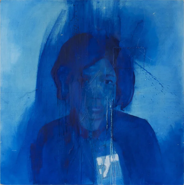 A blue-toned abstract portrait of a person with dark hair, partially obscured by paint drips and textured brushstrokes.