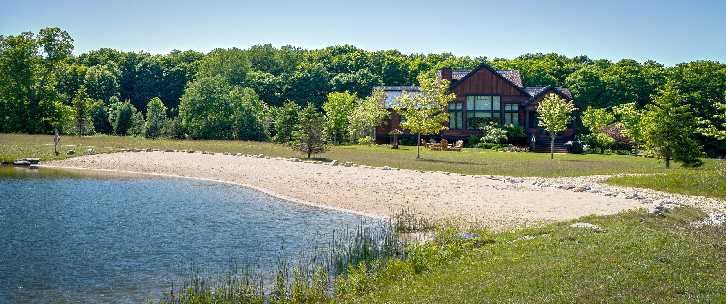 Swimming (or fishing) beach behind the large cabin in True North Golf Course.