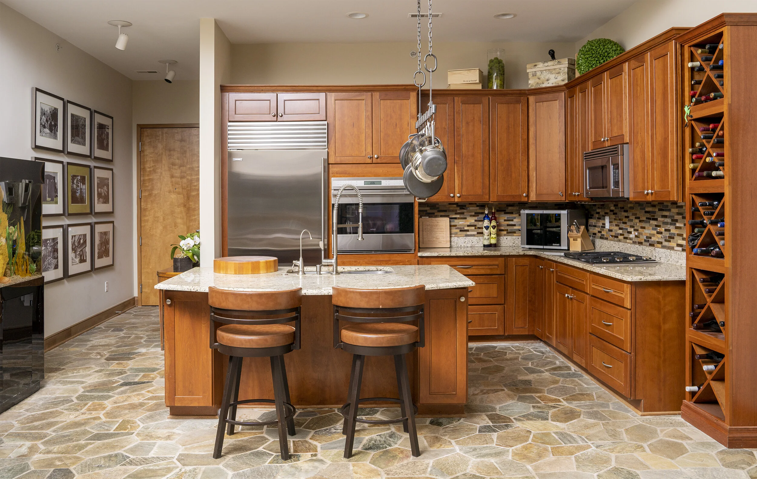 Condo life at its best in this lovely kitchen of a condo overlooking Main Street in downtown Rochester, MI