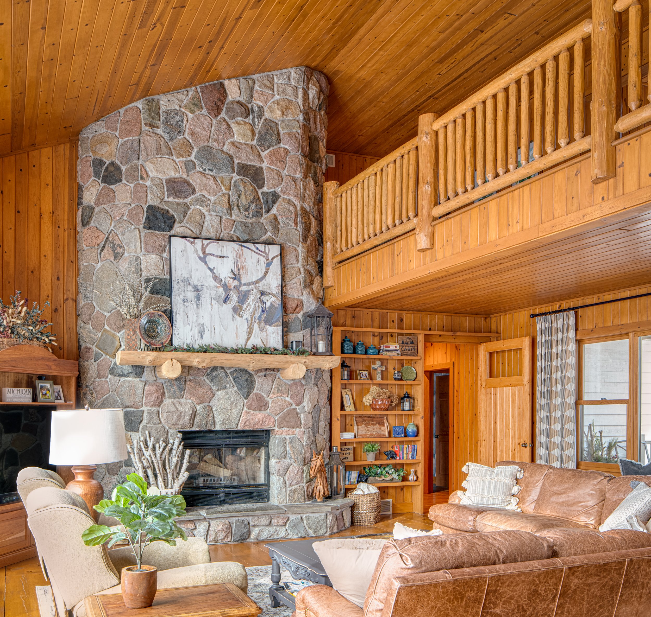 Balcony overlooking the Great Room of a house in the Birchwood Farms Golf and Country Club community near Harbor Springs, MI.