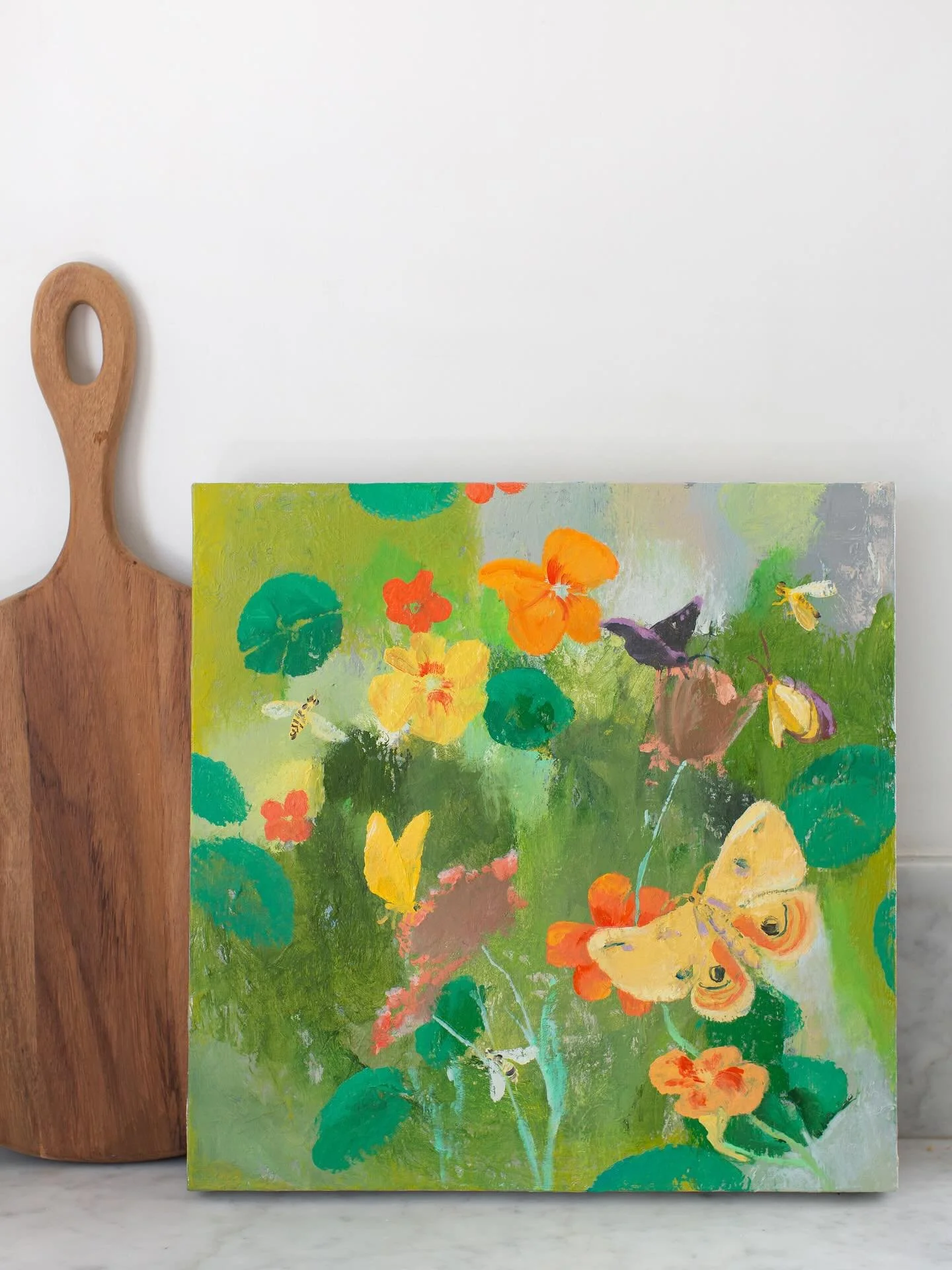 Our nasturtium in front of the gallery is still going strong, and each time I see life fluttering about the flowers, I feel as though I’m living inside this beautiful painting by Melanie Parke. Her “lo the Moth” is a 16in x 16in oil