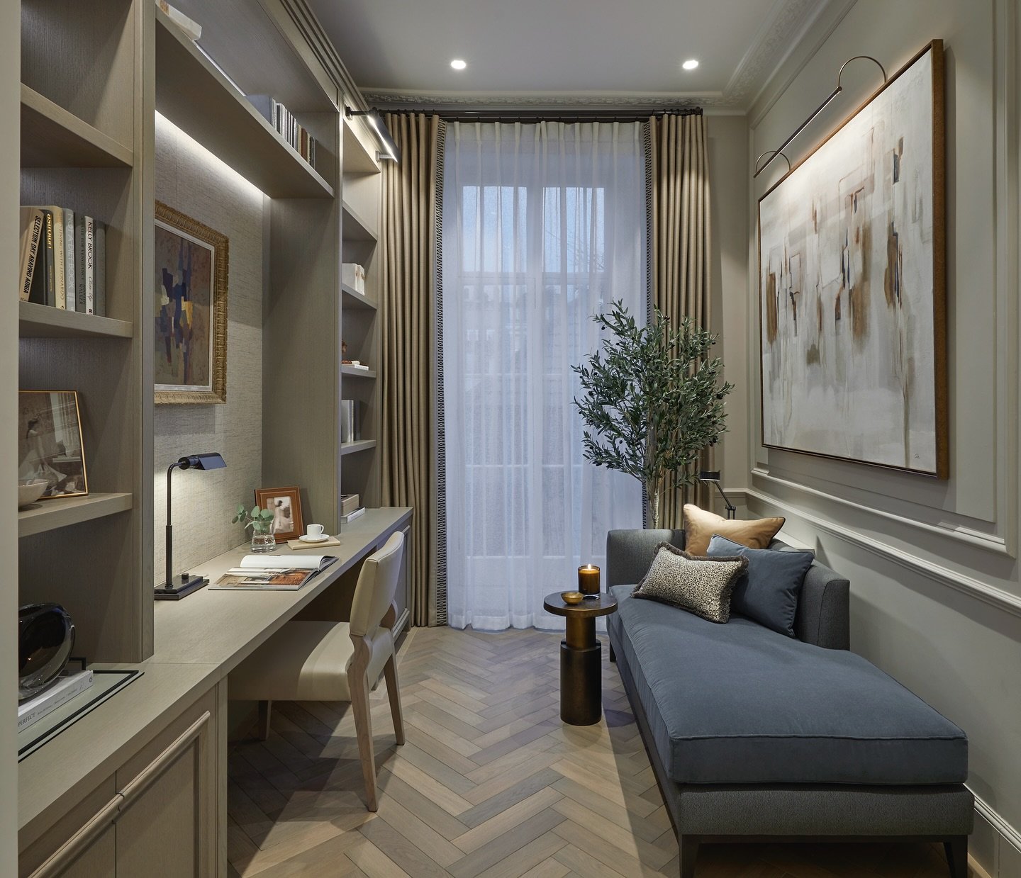 Revolutionise your work-from-home setup to enable you to dive into productivity. At the Library of our Mayfair Townhouse project  we designed a joinery wall with open shelves and an integrated desk area. We also included a cozy seating area. Natural 