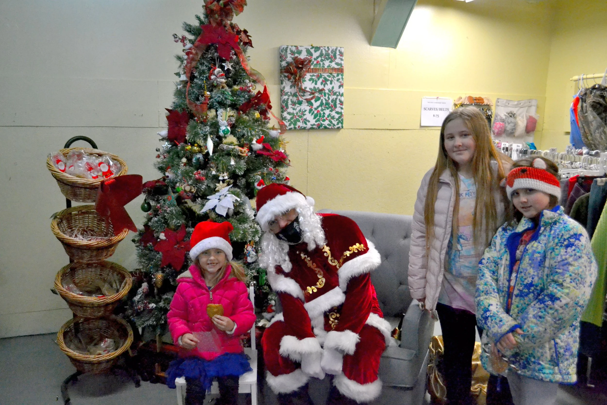 The whole family visits Santa.