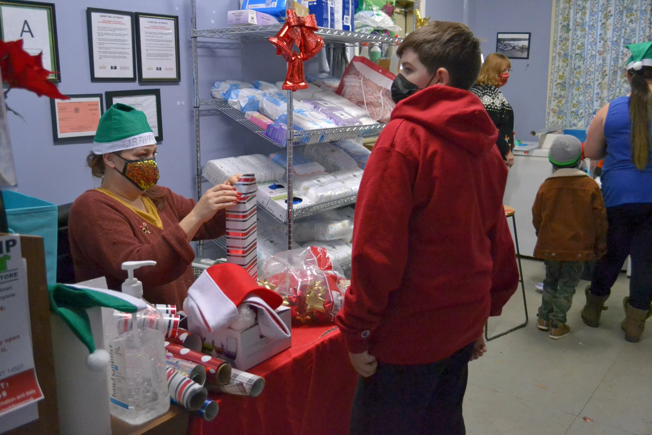 A gift wrap elf at her station. 