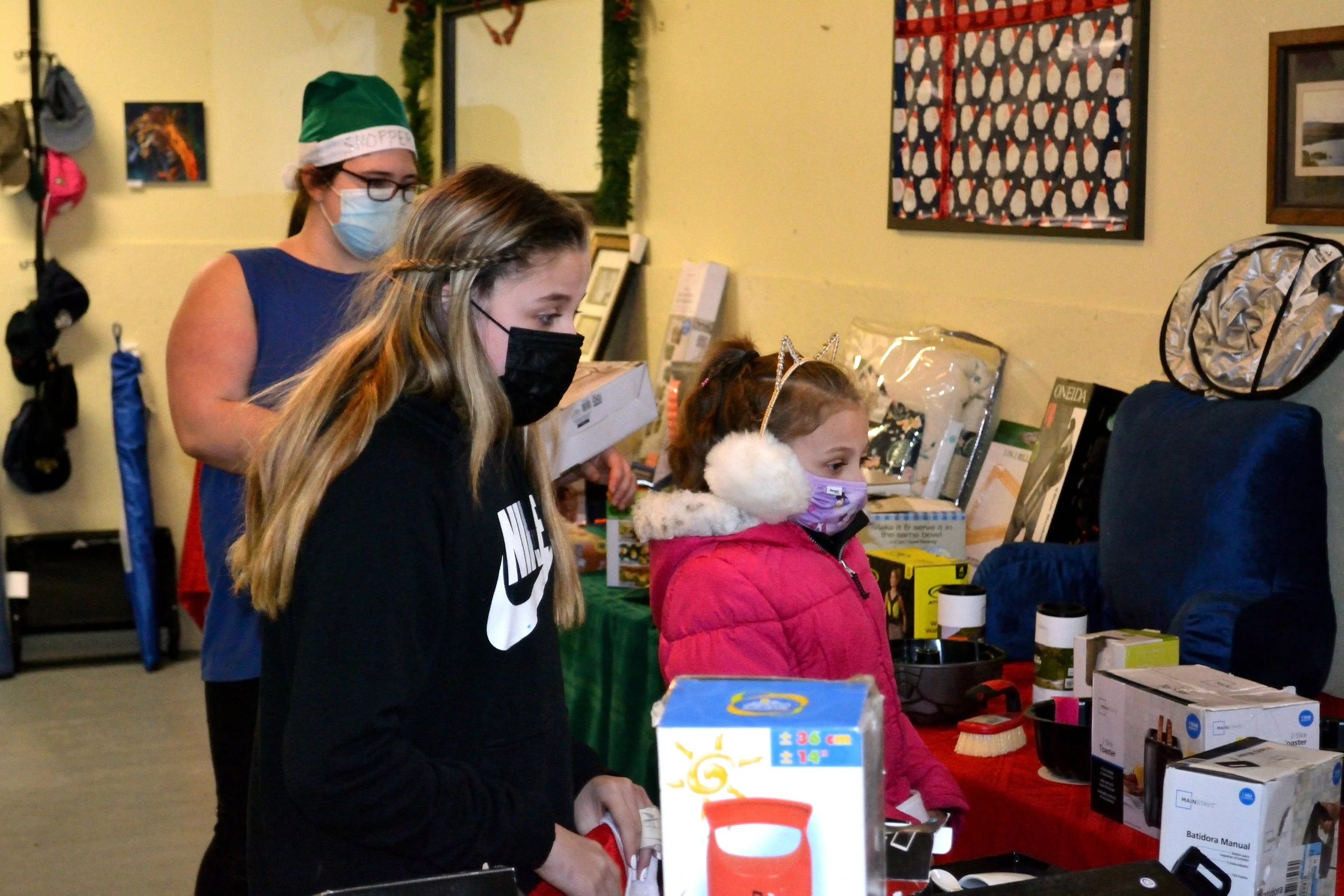Shoppers and a helper. 