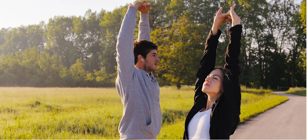 Couple stretching during a morning walk or run