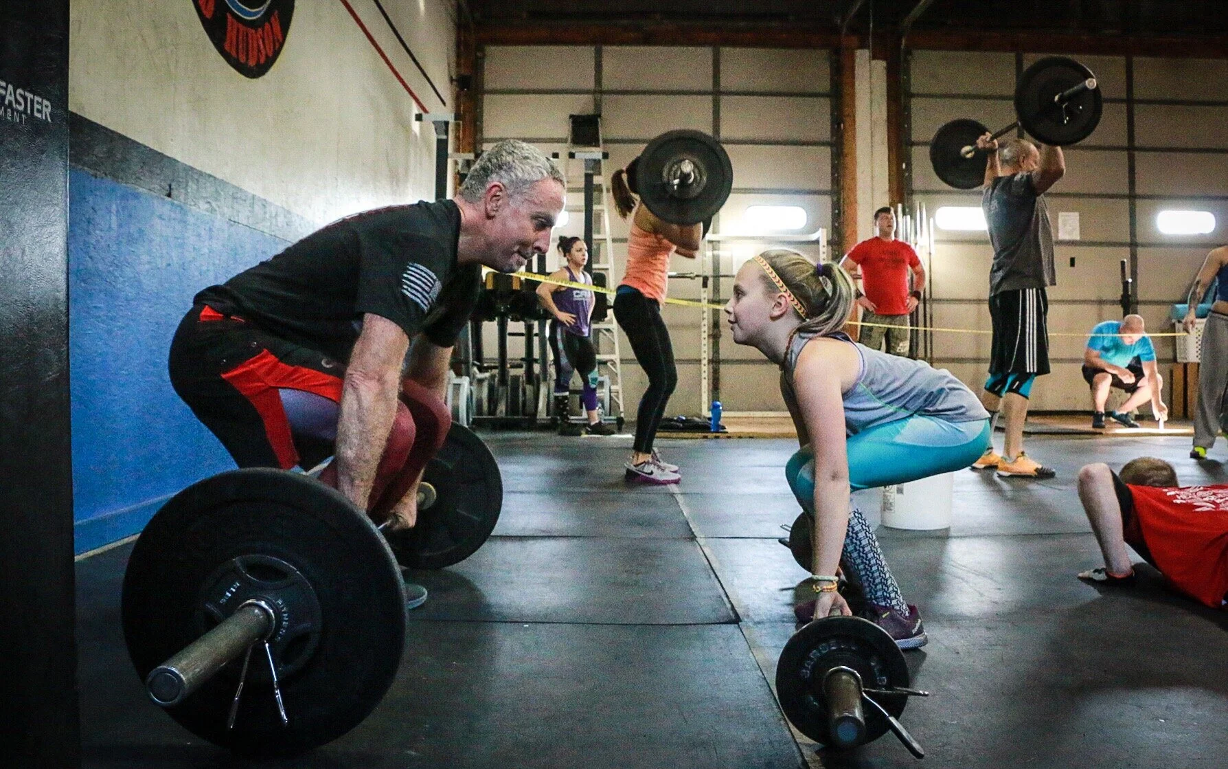 Adult male deadlifting in a gym