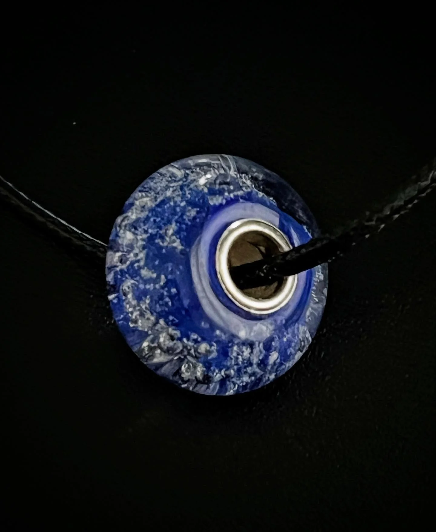 Blue glass memorial bead made with pet ashes